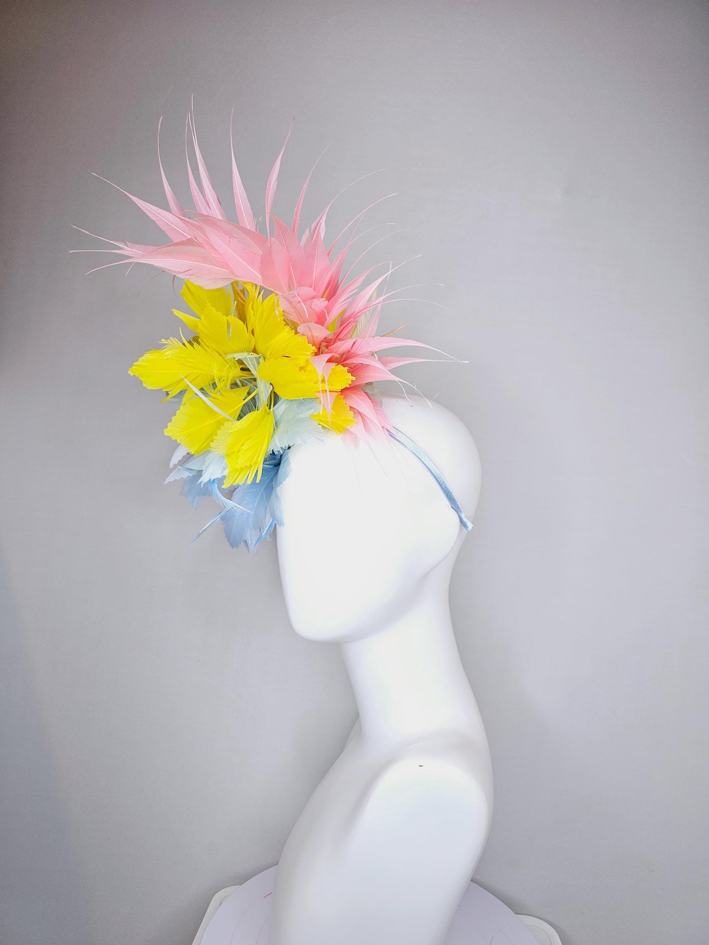 kentucky derby hat fascinator light blue fluffy zigzag feather flower with bright yellow branching feathers and light pink pointy feathers