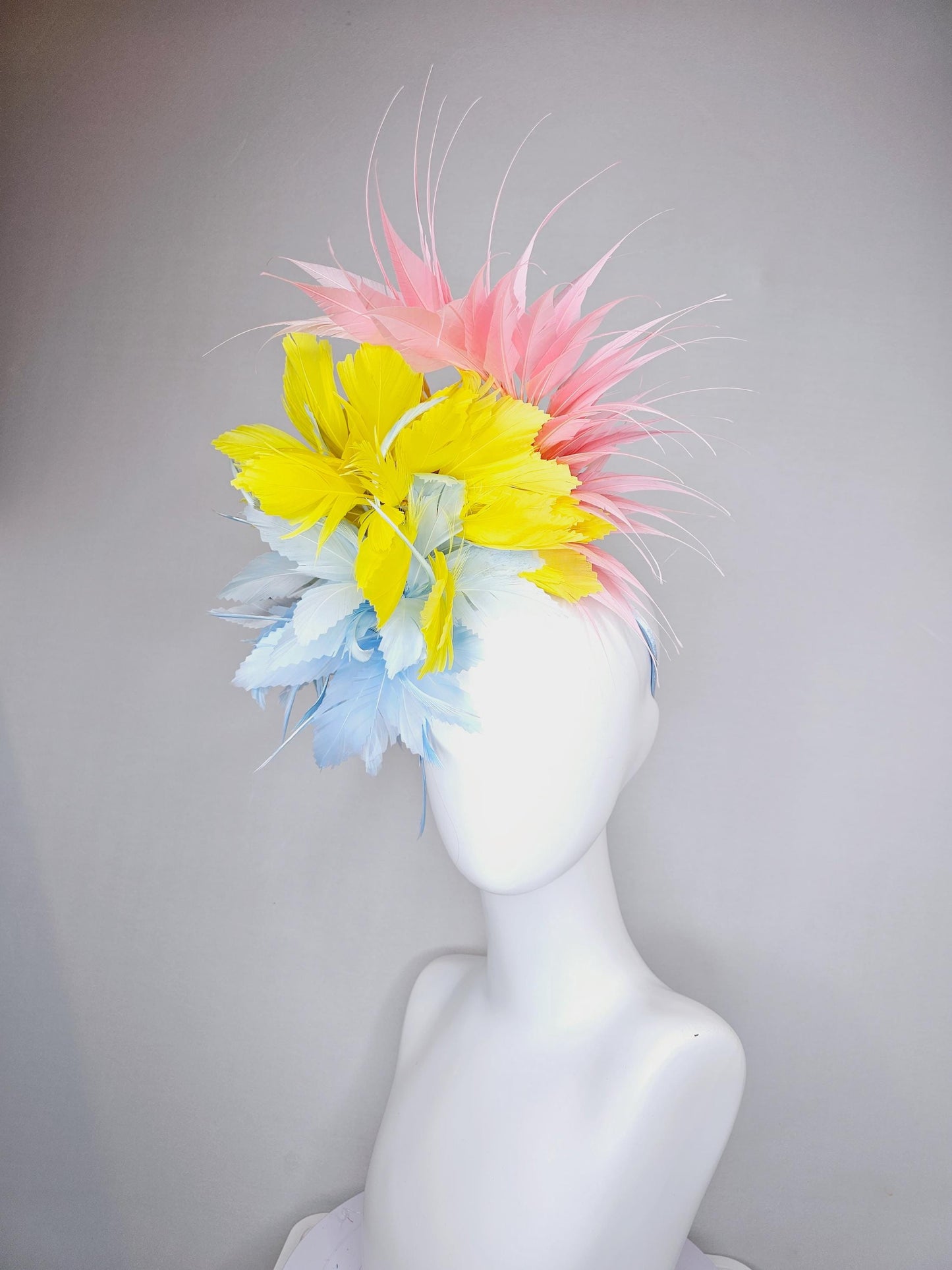 kentucky derby hat fascinator light blue fluffy zigzag feather flower with bright yellow branching feathers and light pink pointy feathers