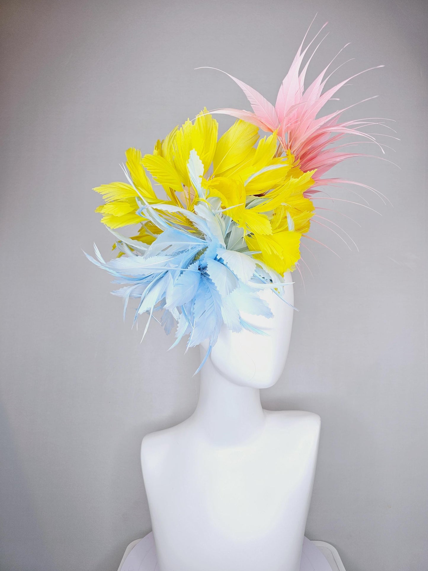 kentucky derby hat fascinator light blue fluffy zigzag feather flower with bright yellow branching feathers and light pink pointy feathers