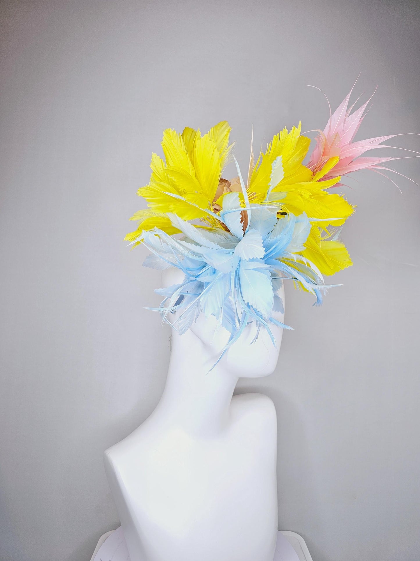 kentucky derby hat fascinator light blue fluffy zigzag feather flower with bright yellow branching feathers and light pink pointy feathers