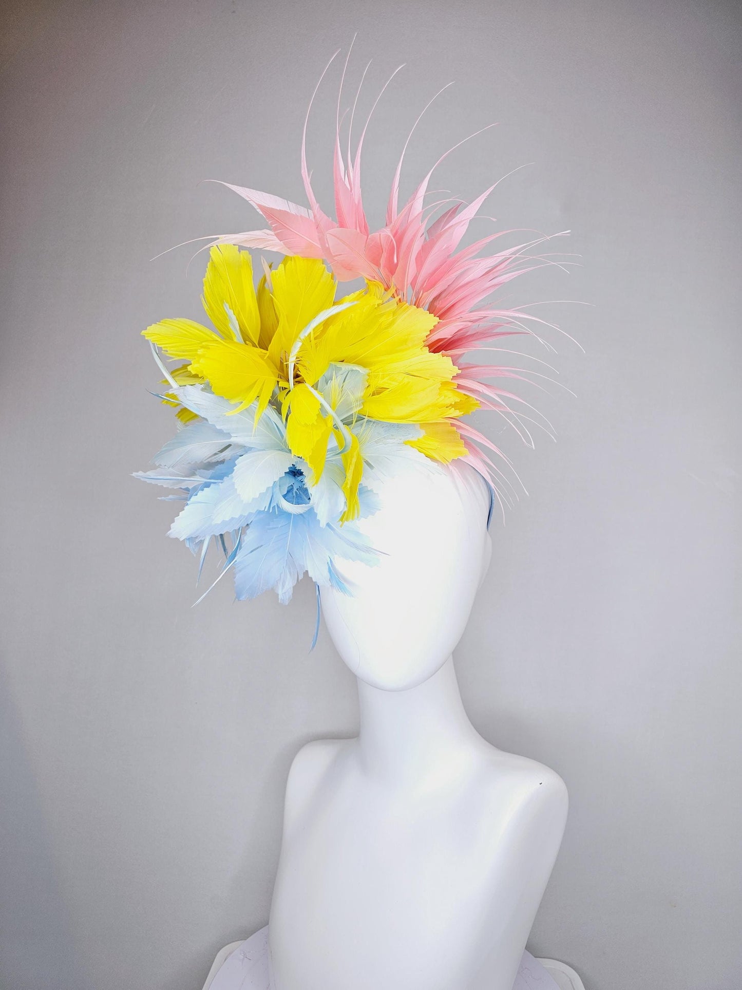 kentucky derby hat fascinator light blue fluffy zigzag feather flower with bright yellow branching feathers and light pink pointy feathers