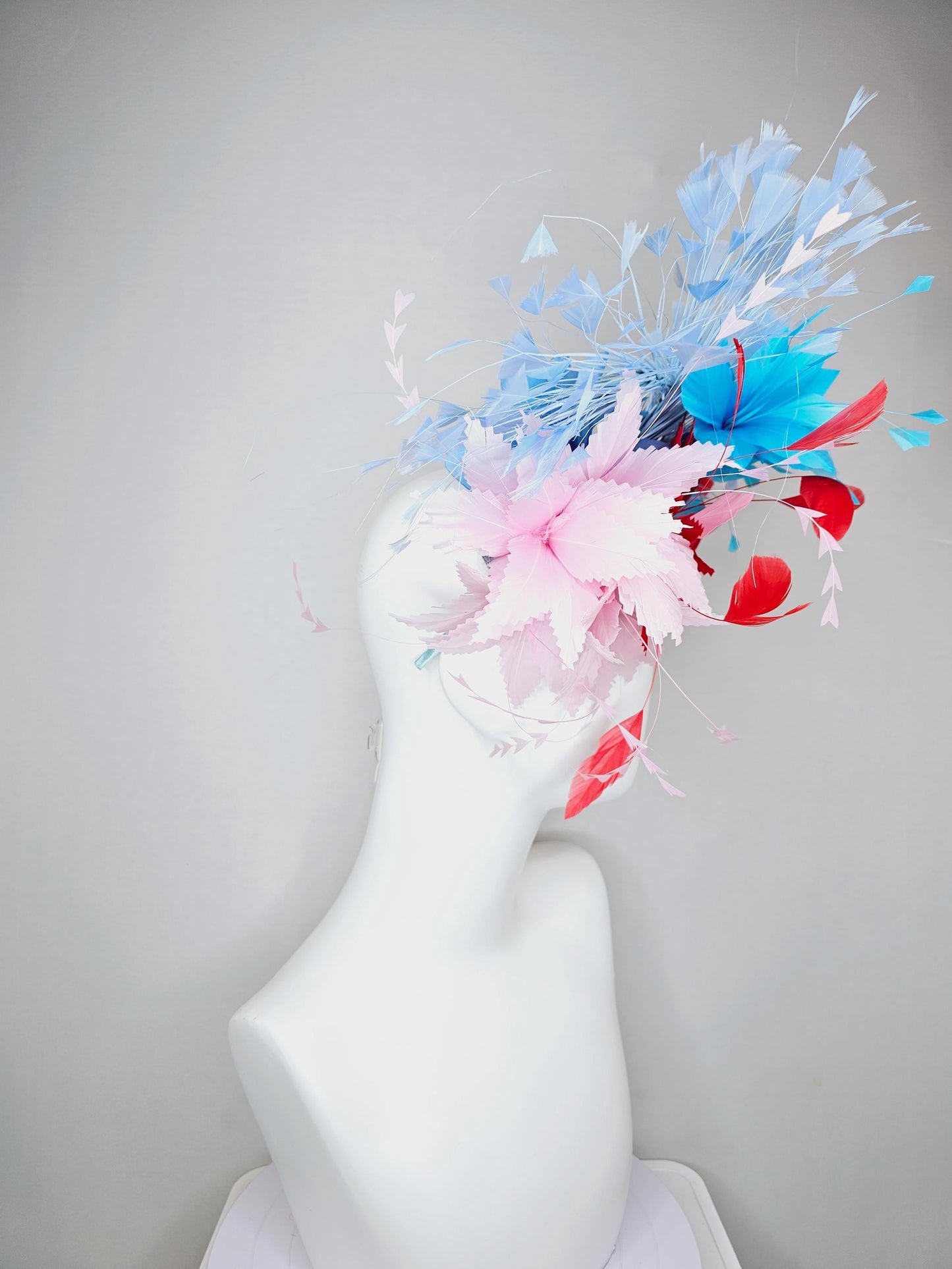 kentucky derby hat fascinator light pink and cherry red zigzag feather flowers with bright sky blue and light blue branching feathers