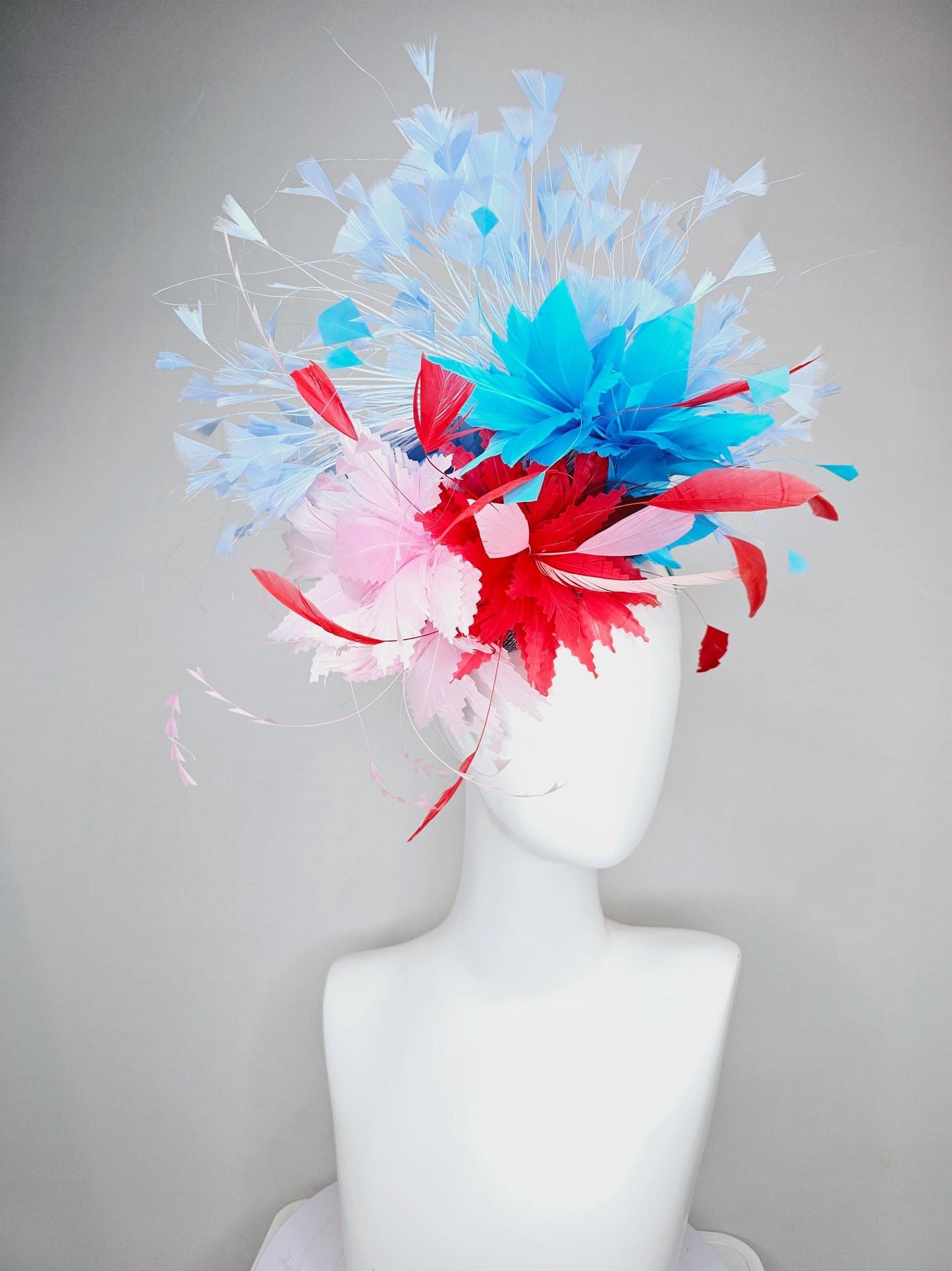 kentucky derby hat fascinator light pink and cherry red zigzag feather flowers with bright sky blue and light blue branching feathers