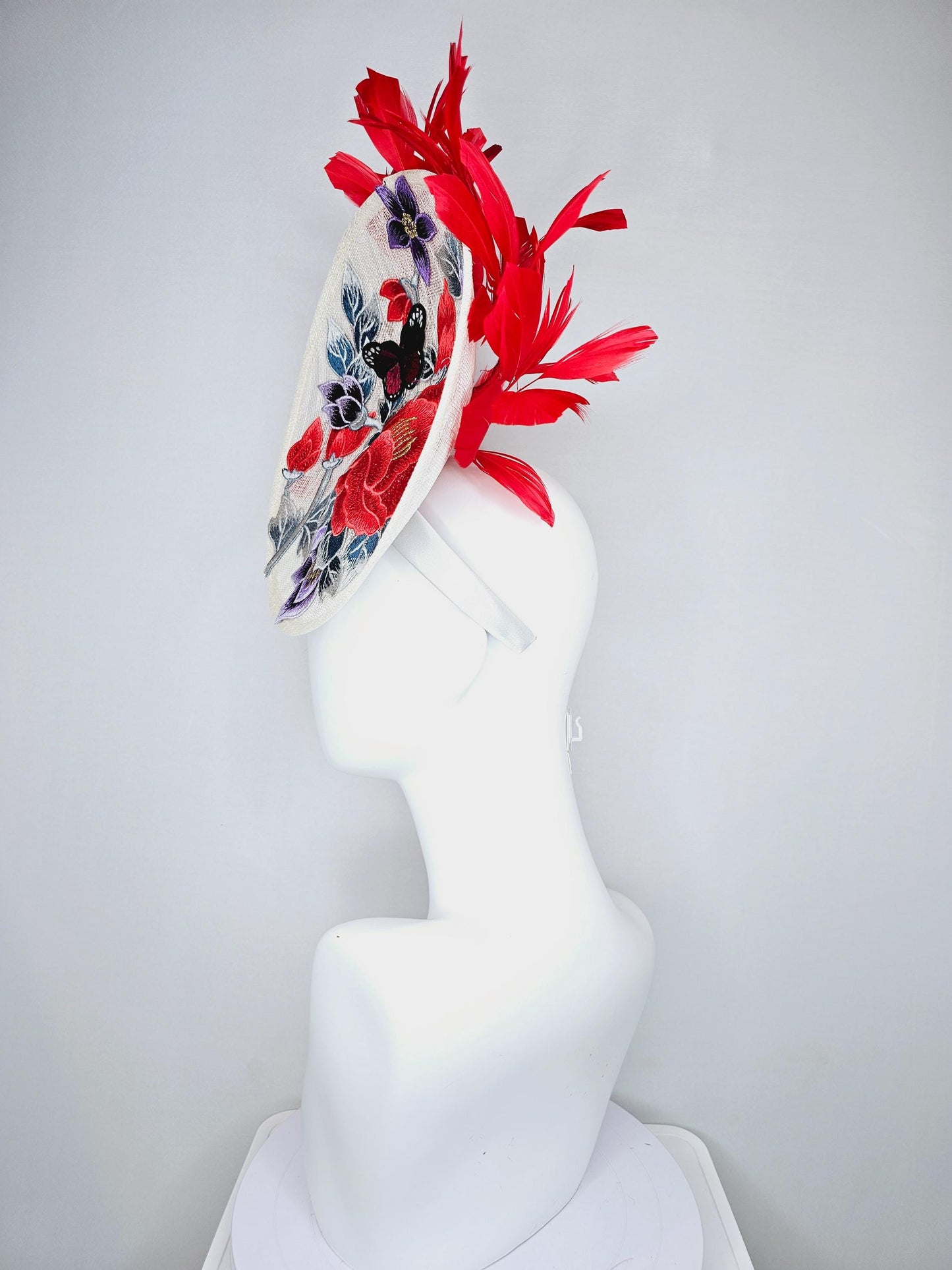 kentucky derby hat fascinator white sinamay saucer with red blue purple black embroidered flowers butterfly, scarlet red branching feathers