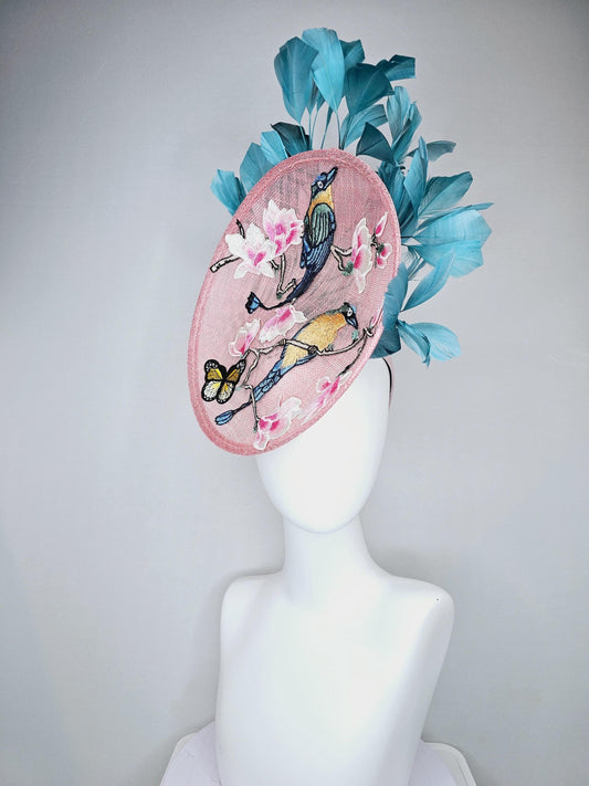 kentucky derby hat fascinator light pink sinamay saucer with pink blue yellow green embroidered birds flowers butterfly, teal blue feathers