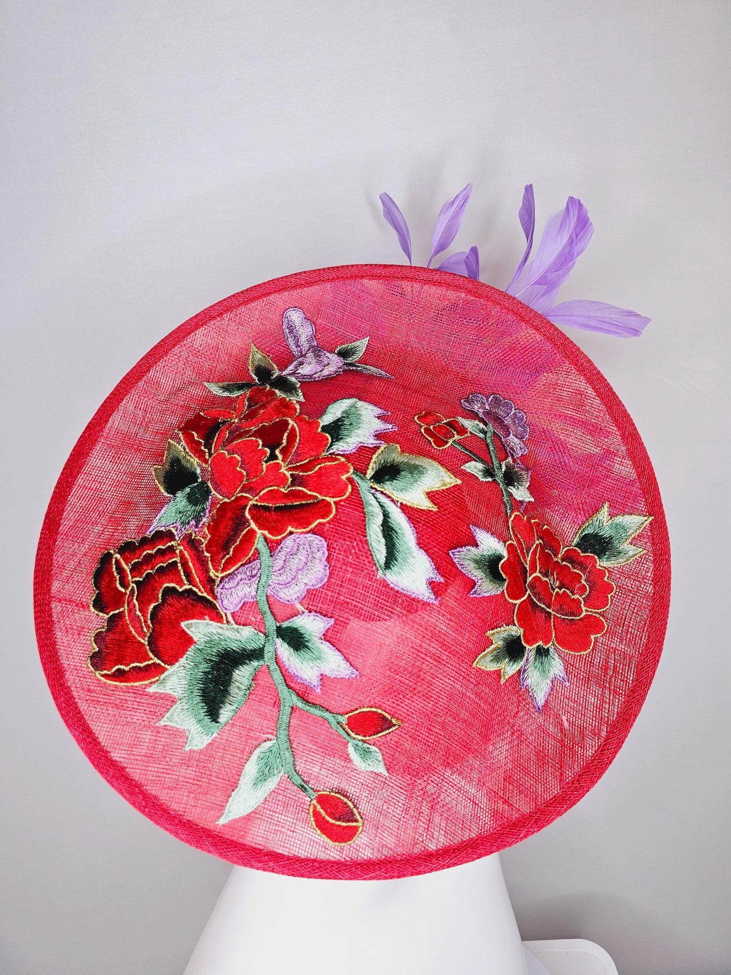 kentucky derby hat fascinator red sinamay saucer with red purple gold green embroidered flowers and lavender purple branching feathers