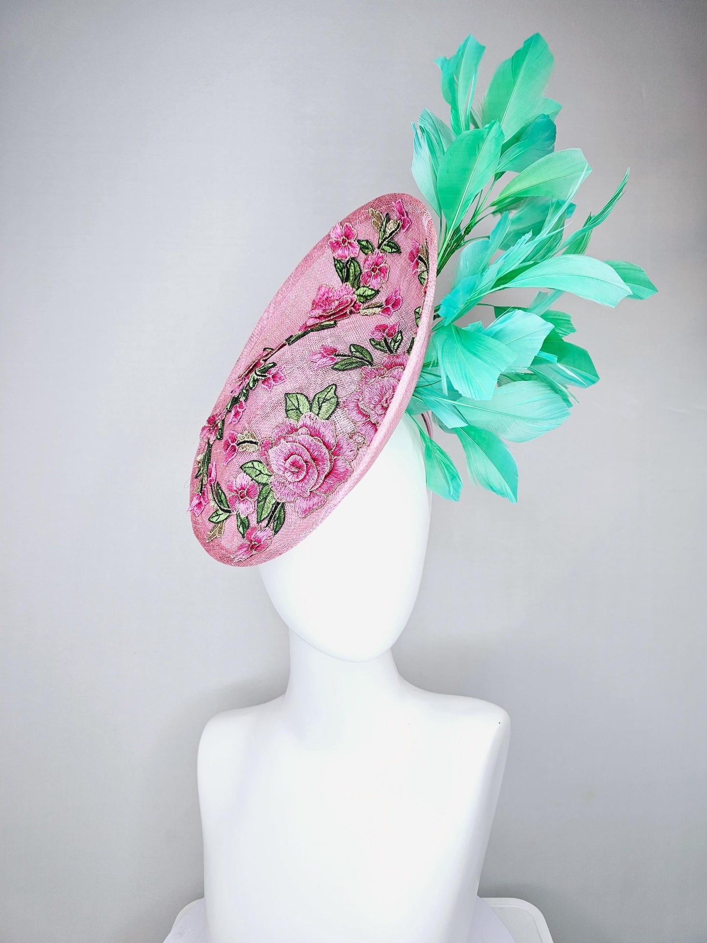 kentucky derby hat fascinator light pink sinamay saucer with pink flowers green leaves embroidered and aqua mint green branching feathers