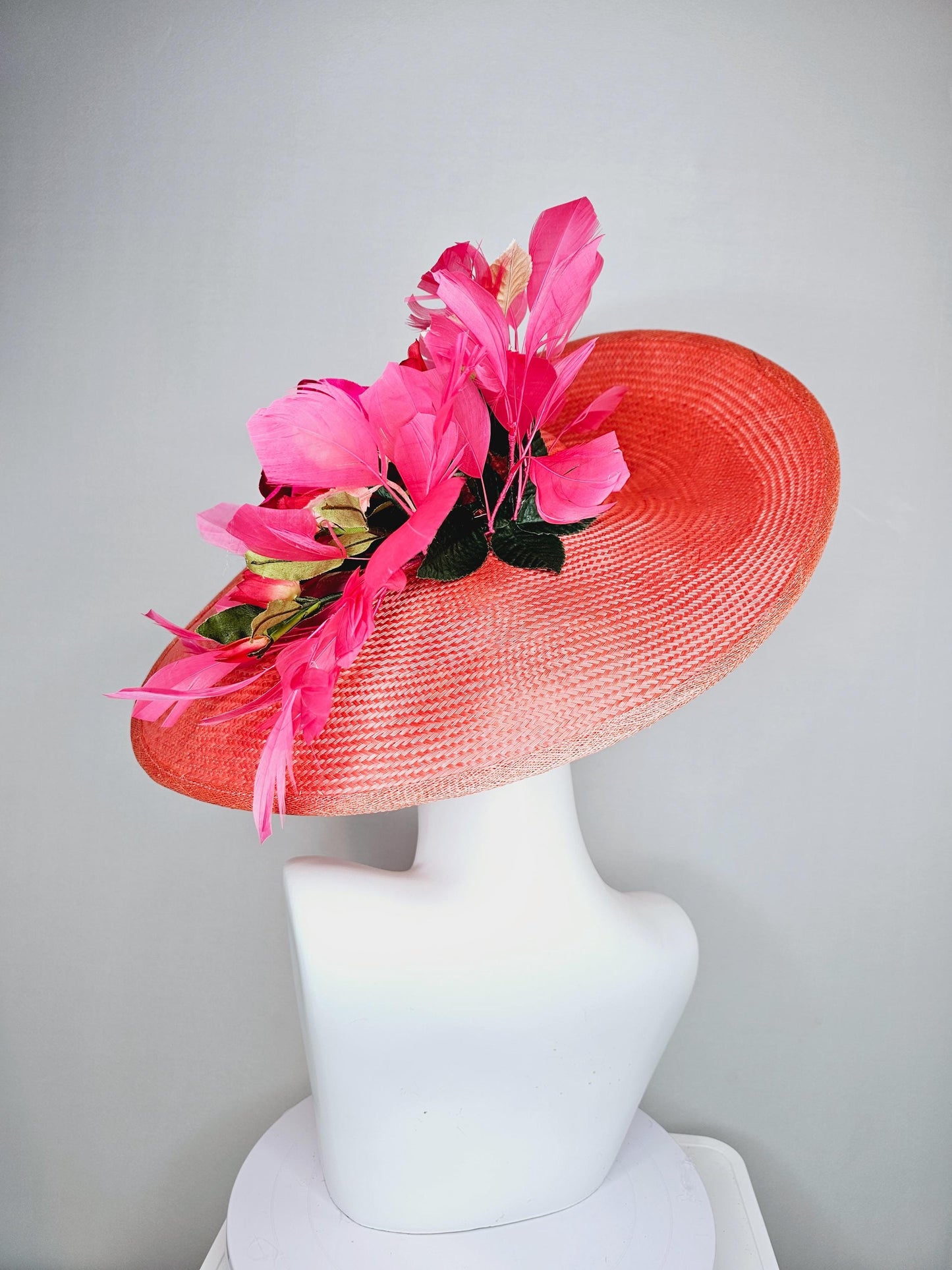 kentucky derby hat wide brim straw in coral orange with pink branching feathers hot pink satin roses green light pink gold leaves