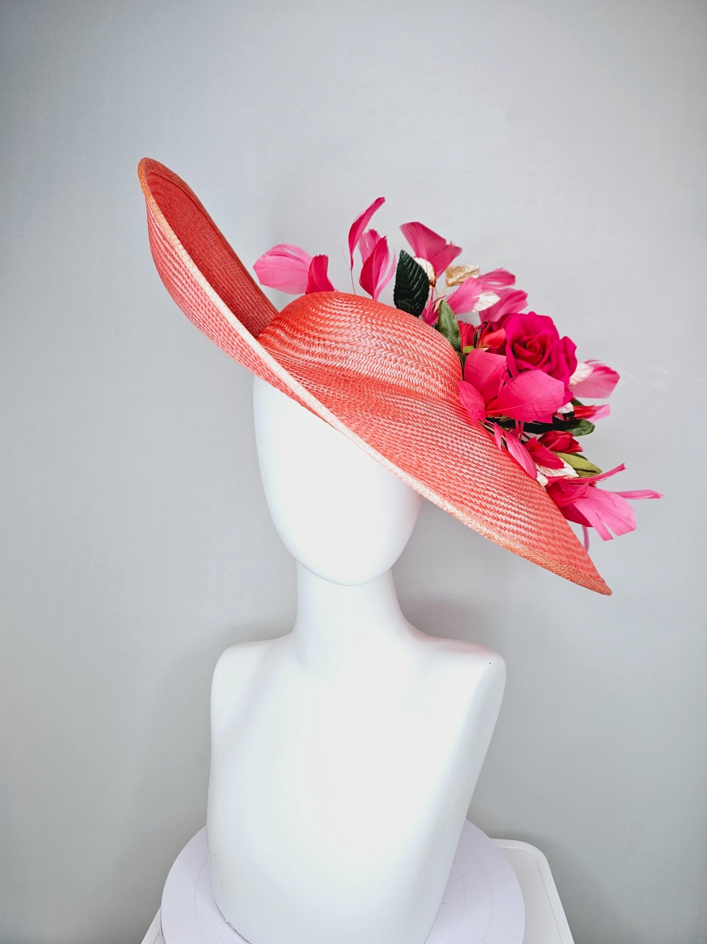 kentucky derby hat wide brim straw in coral orange with pink branching feathers hot pink satin roses green light pink gold leaves