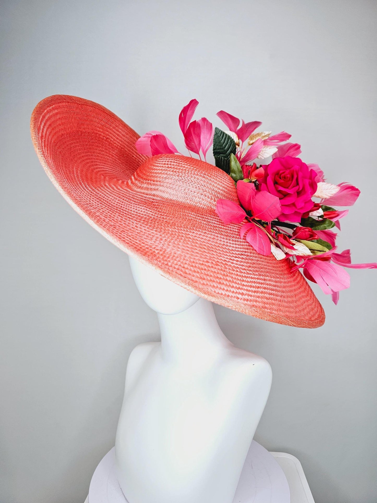 kentucky derby hat wide brim straw in coral orange with pink branching feathers hot pink satin roses green light pink gold leaves