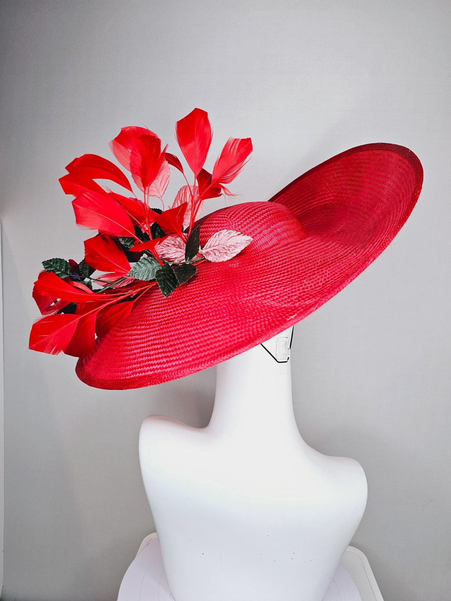 kentucky derby hat wide brim straw in red with scarlet red branching feathers with burgundy red satin roses and light pink dark green leaves