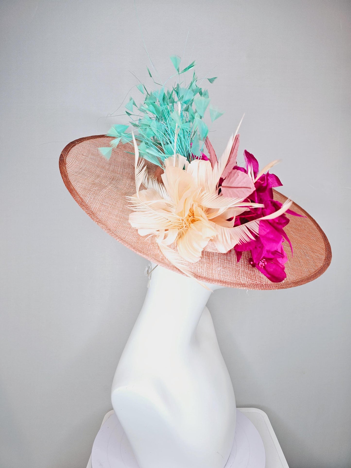 kentucky derby hat wide brim coral orange sinamay with bright fuchsia pink satin roses light pink leaves mint green neutral beige feathers