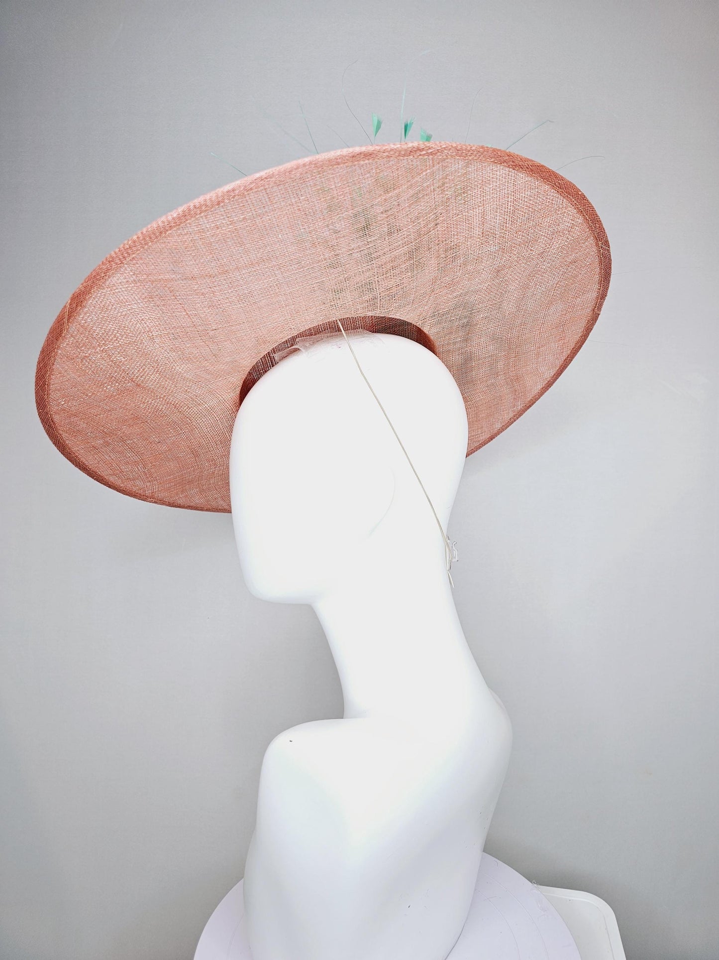 kentucky derby hat wide brim coral orange sinamay with bright fuchsia pink satin roses light pink leaves mint green neutral beige feathers