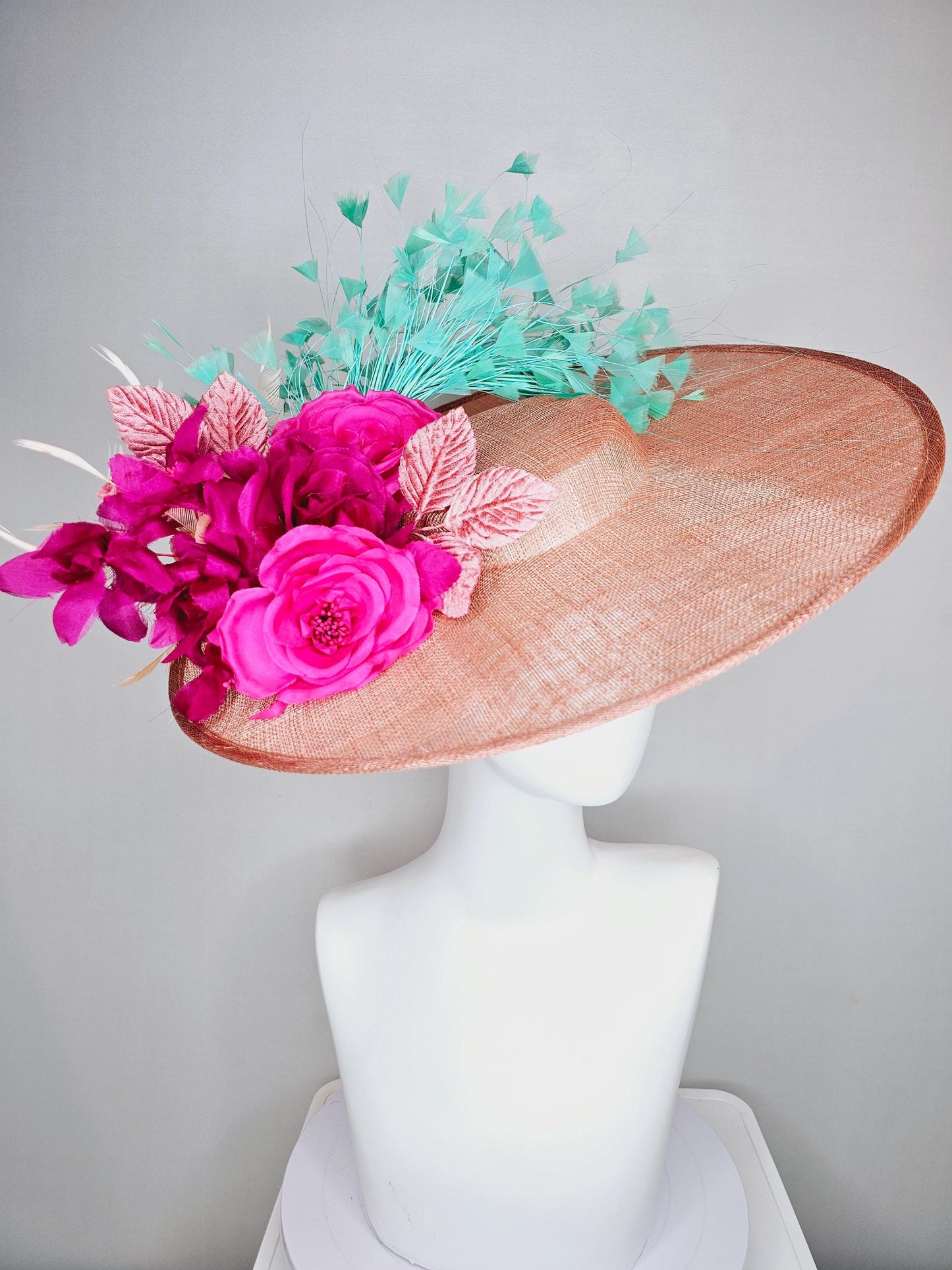 kentucky derby hat wide brim coral orange sinamay with bright fuchsia pink satin roses light pink leaves mint green neutral beige feathers