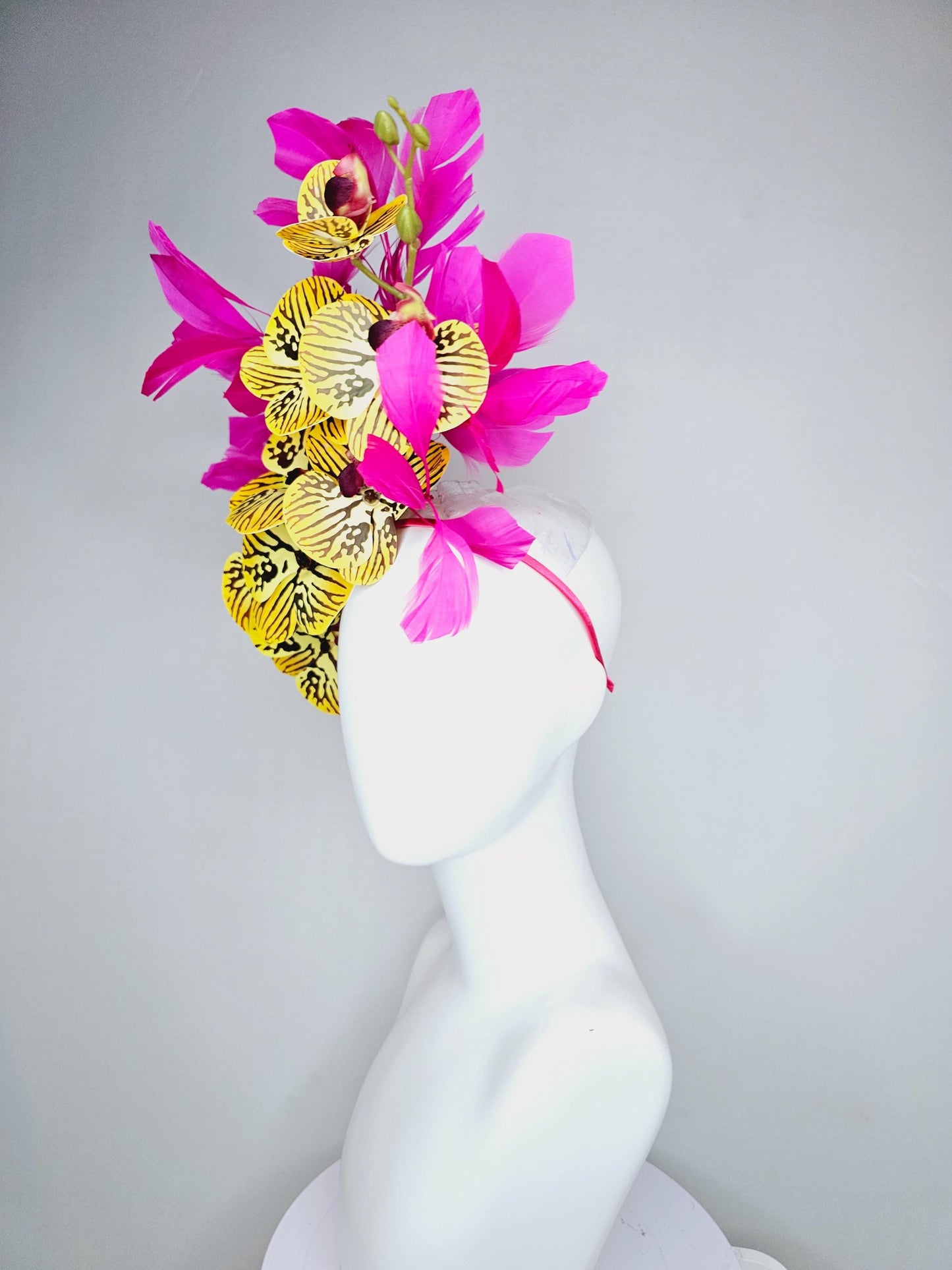 kentucky derby hat fascinator large yellow black and burgundy red satin silk orchid flowers with bright fuchsia pink branching feathers