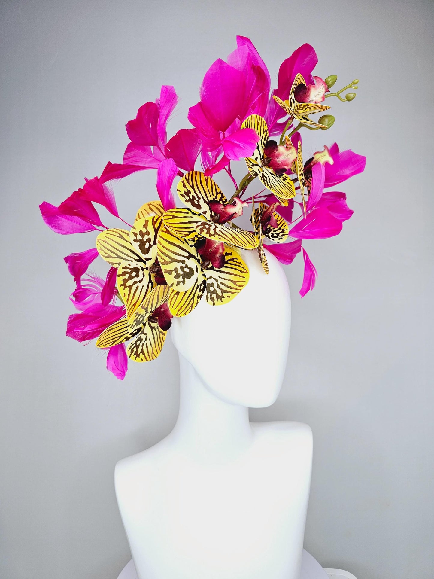 kentucky derby hat fascinator large yellow black and burgundy red satin silk orchid flowers with bright fuchsia pink branching feathers