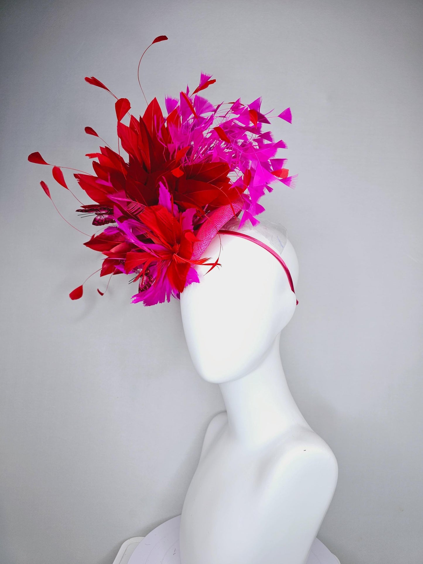 kentucky derby hat fascinator pink sinamay with scarlet red and fuchsia pink zigzag feather flower red pink feathers red pink butterflies
