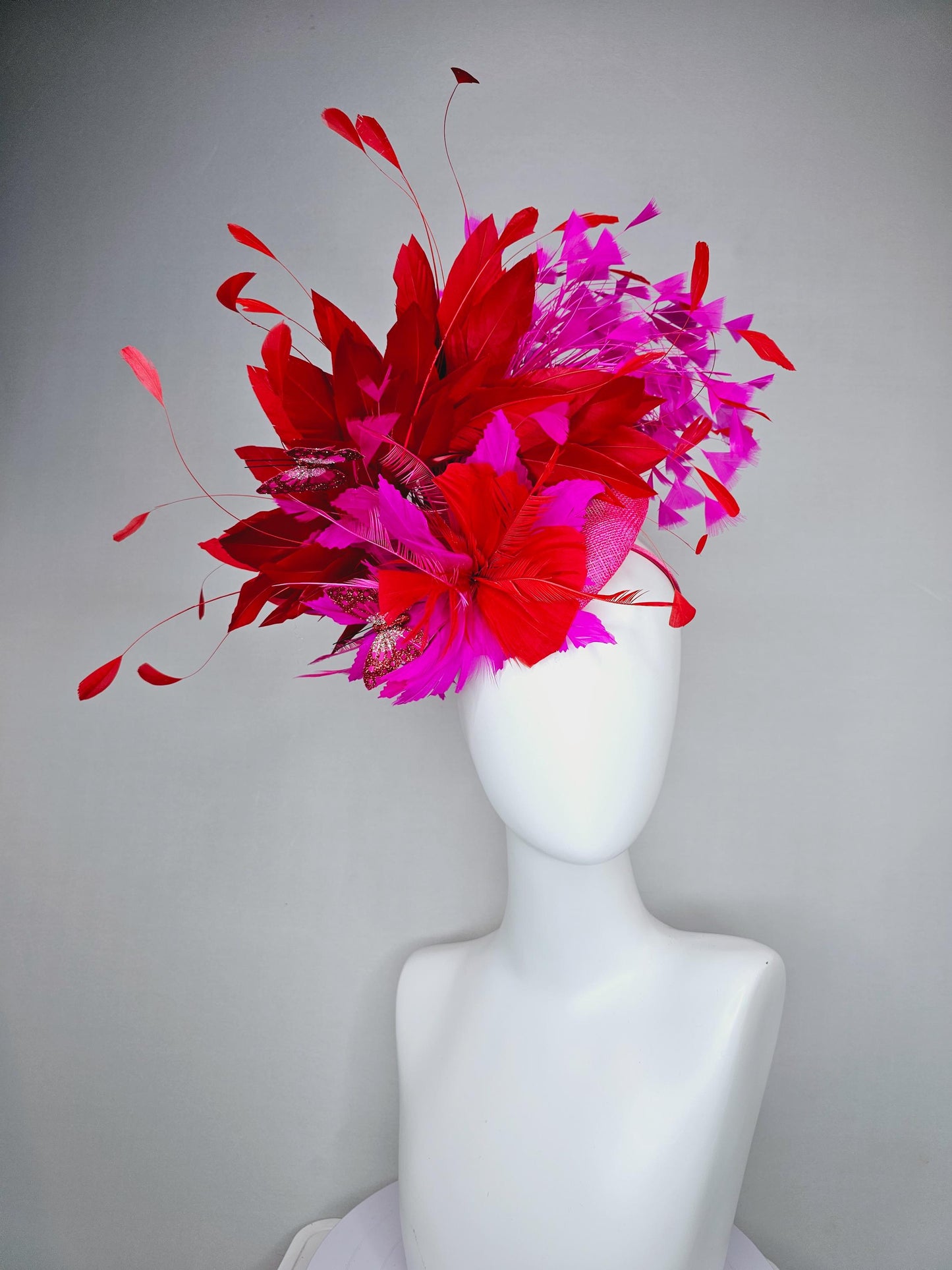 kentucky derby hat fascinator pink sinamay with scarlet red and fuchsia pink zigzag feather flower red pink feathers red pink butterflies