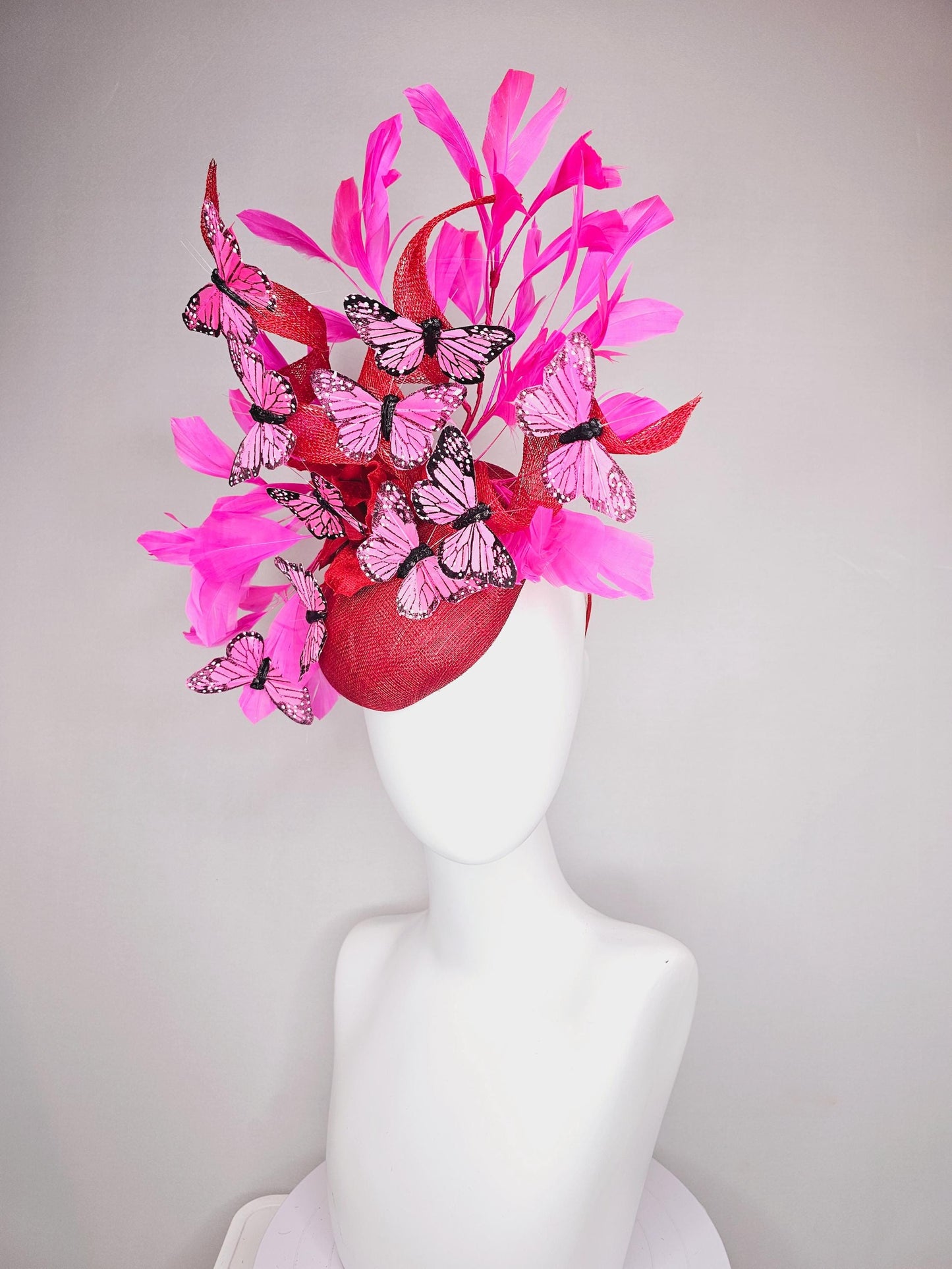 kentucky derby hat fascinator cherry red sinamay with curls hot pink fuchsia branching feathers and pink and black butterflies