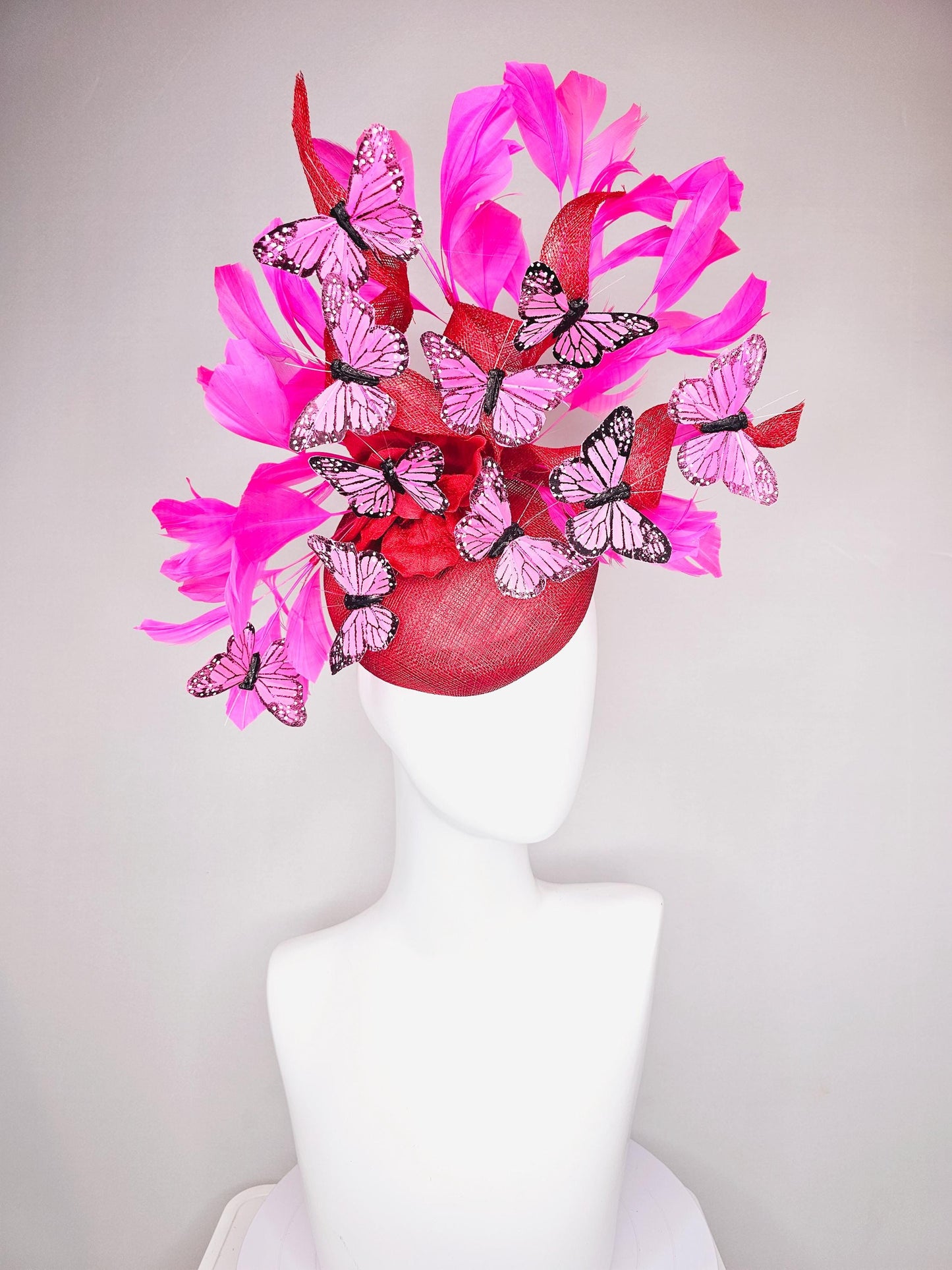 kentucky derby hat fascinator cherry red sinamay with curls hot pink fuchsia branching feathers and pink and black butterflies