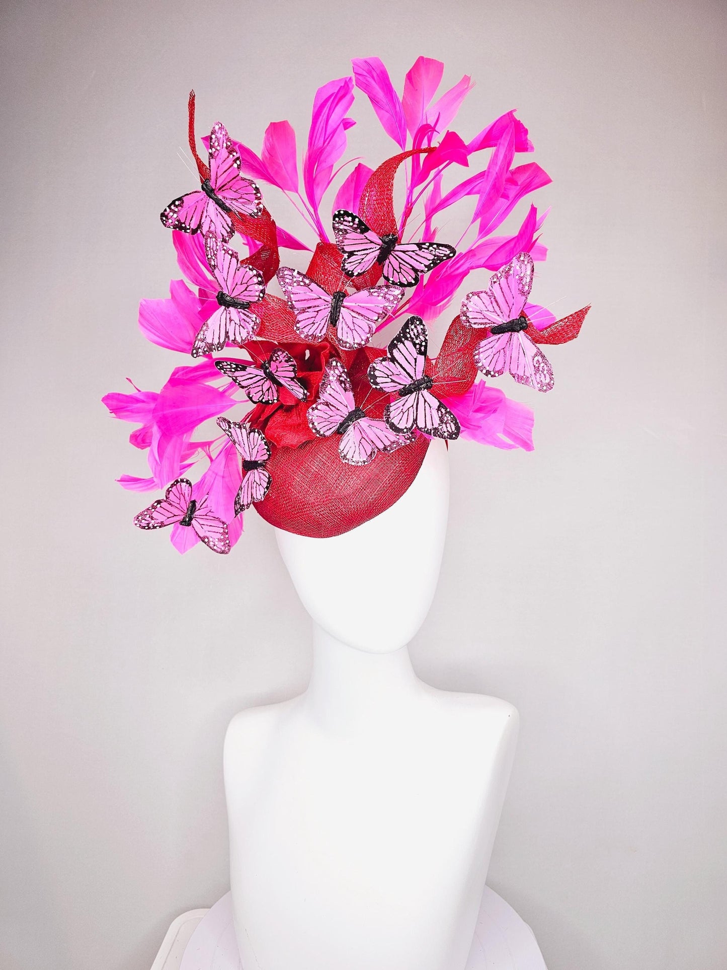 kentucky derby hat fascinator cherry red sinamay with curls hot pink fuchsia branching feathers and pink and black butterflies