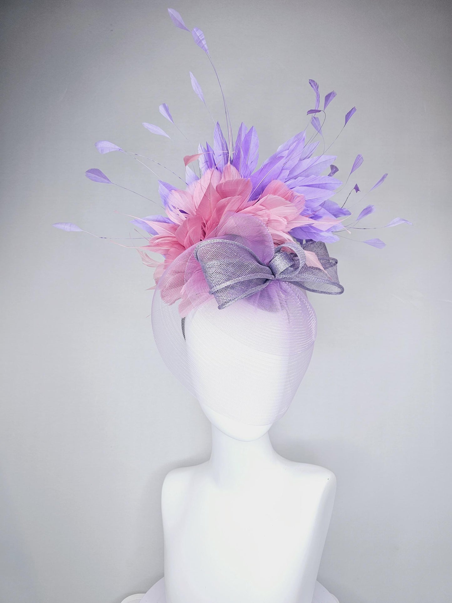 kentucky derby hat fascinator large purple sinamay bow with lavender and light pink branching feathers with purple mesh veil on a headband