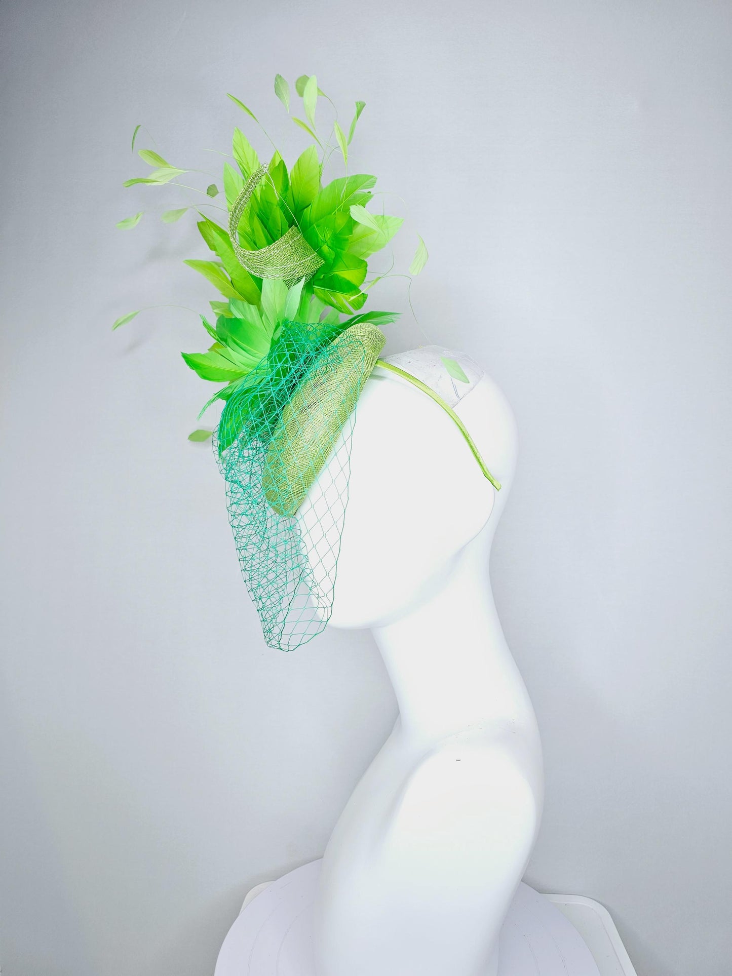 kentucky derby hat fascinator lime green sinamay with sinamay curls bright green feather flower lime green feathers with green mesh veil