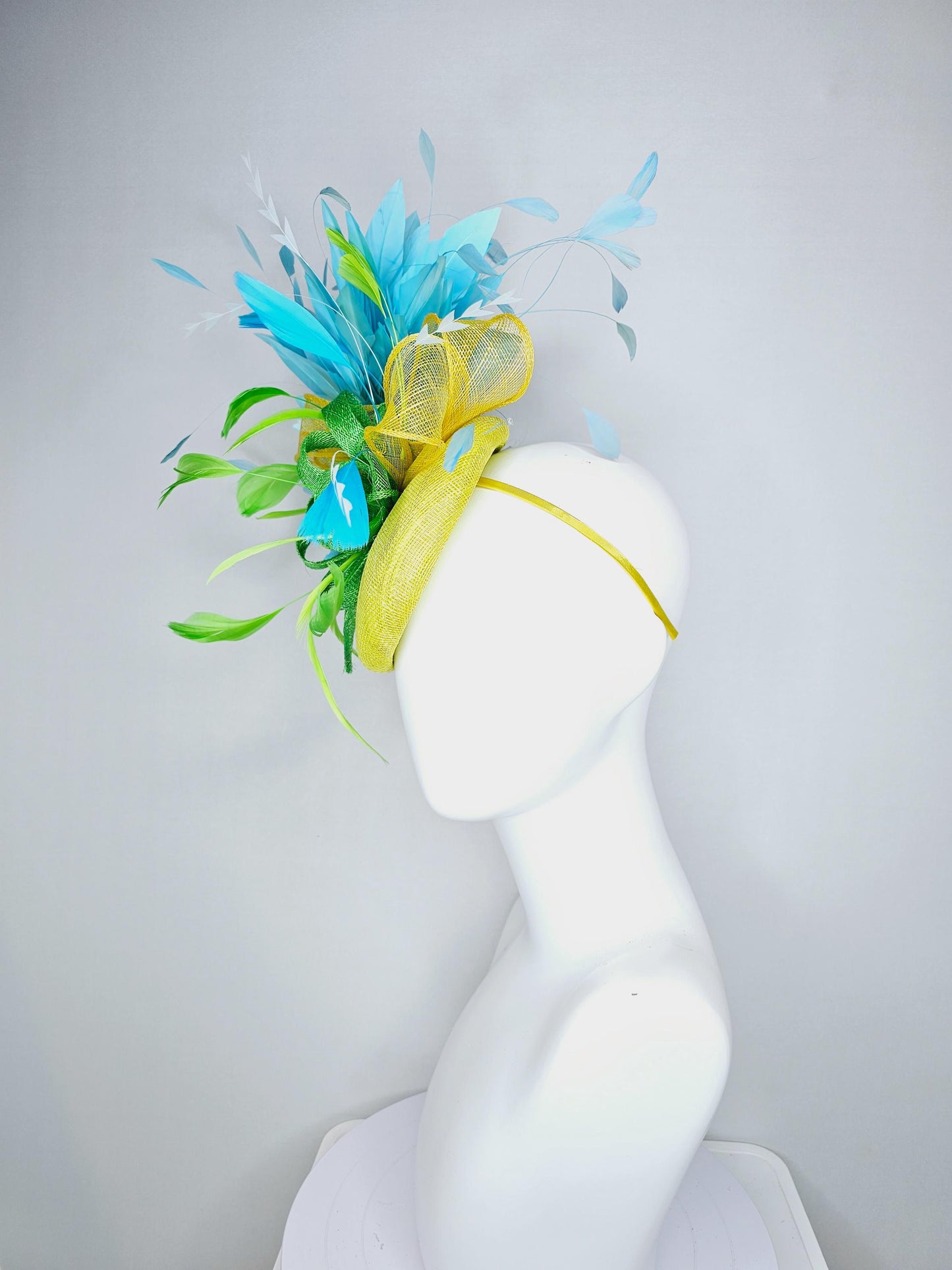 kentucky derby hat fascinator yellow sinamay with yellow and lime green sinamay bow white cut feathers and sky blue branching feathers