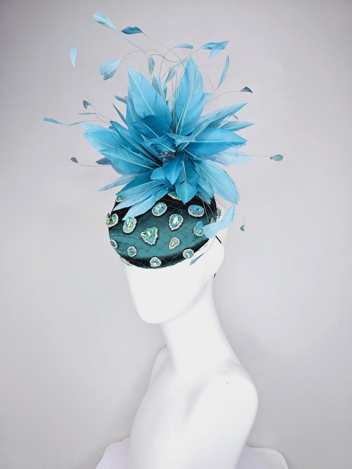 kentucky derby hat fascinator dark green satin with netting and green iridescent crystal rhinestone beaded fluffy peacock teal blue feathers