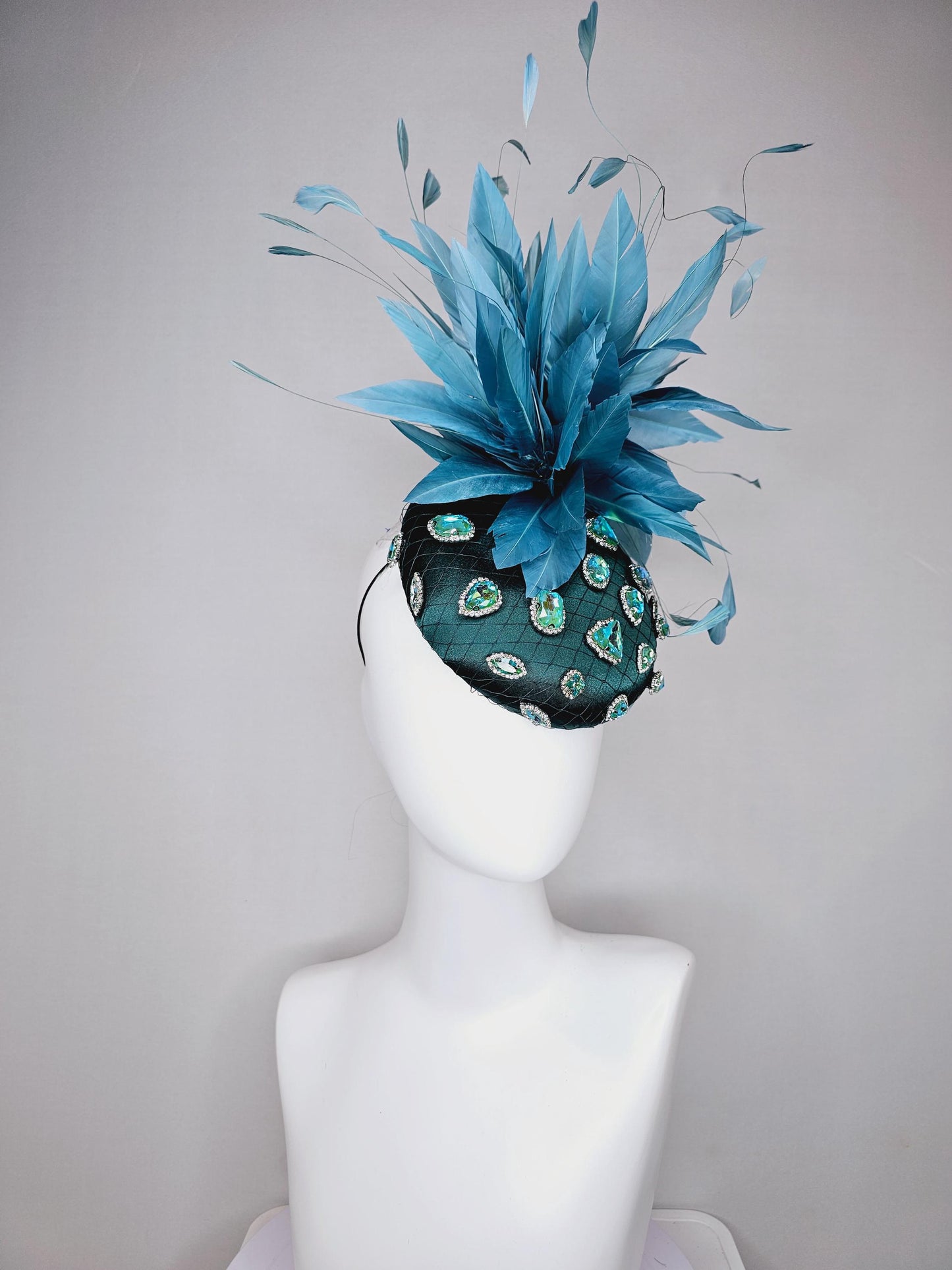 kentucky derby hat fascinator dark green satin with netting and green iridescent crystal rhinestone beaded fluffy peacock teal blue feathers