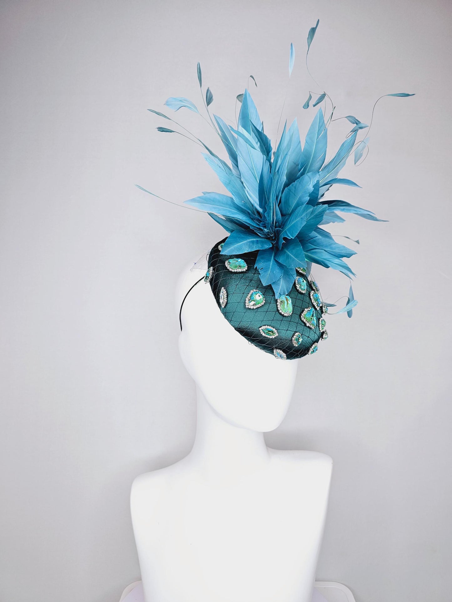 kentucky derby hat fascinator dark green satin with netting and green iridescent crystal rhinestone beaded fluffy peacock teal blue feathers