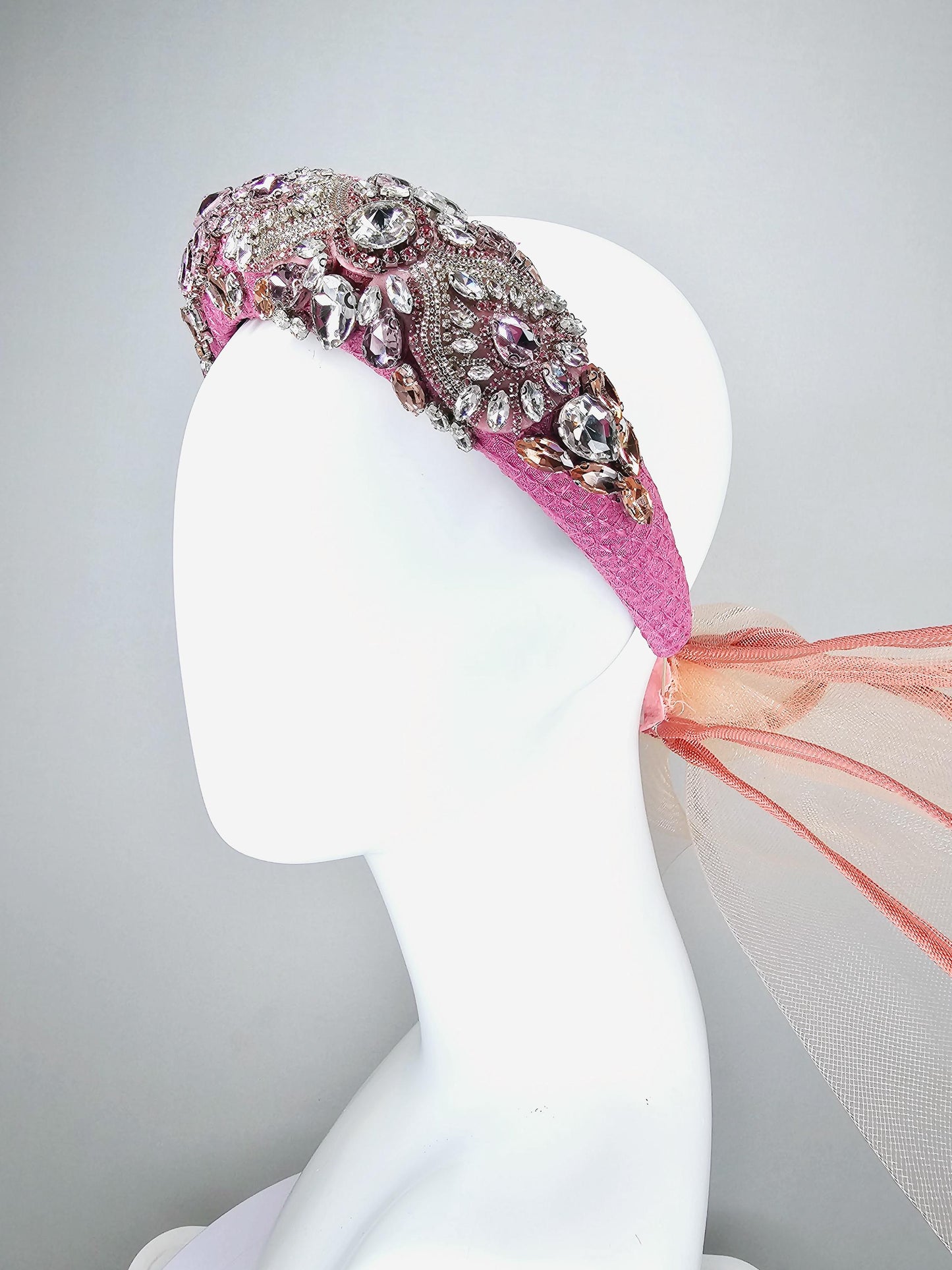 kentucky derby hat fascinator pink headband with iridescent pink tones crystal rhinestone encrusted jewels large dusty blush pink mesh bow