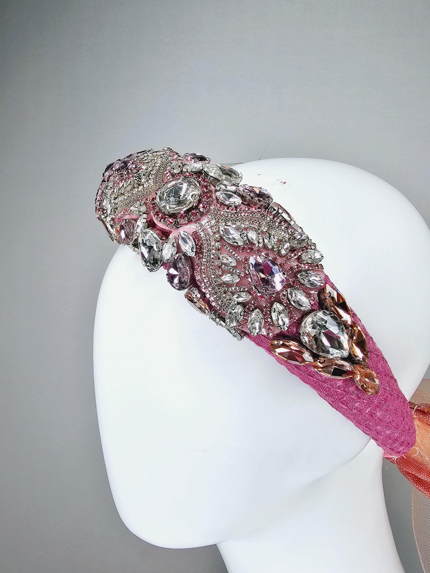 kentucky derby hat fascinator pink headband with iridescent pink tones crystal rhinestone encrusted jewels large dusty blush pink mesh bow
