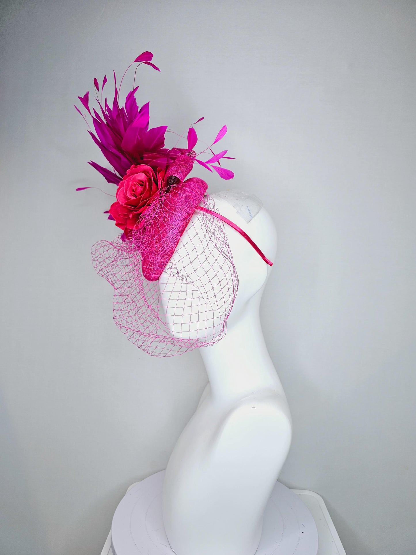 kentucky derby hat fascinator bright pink sinamay with sinamay bow and raspberry pink satin roses fuchsia pink feathers and pink mesh veil