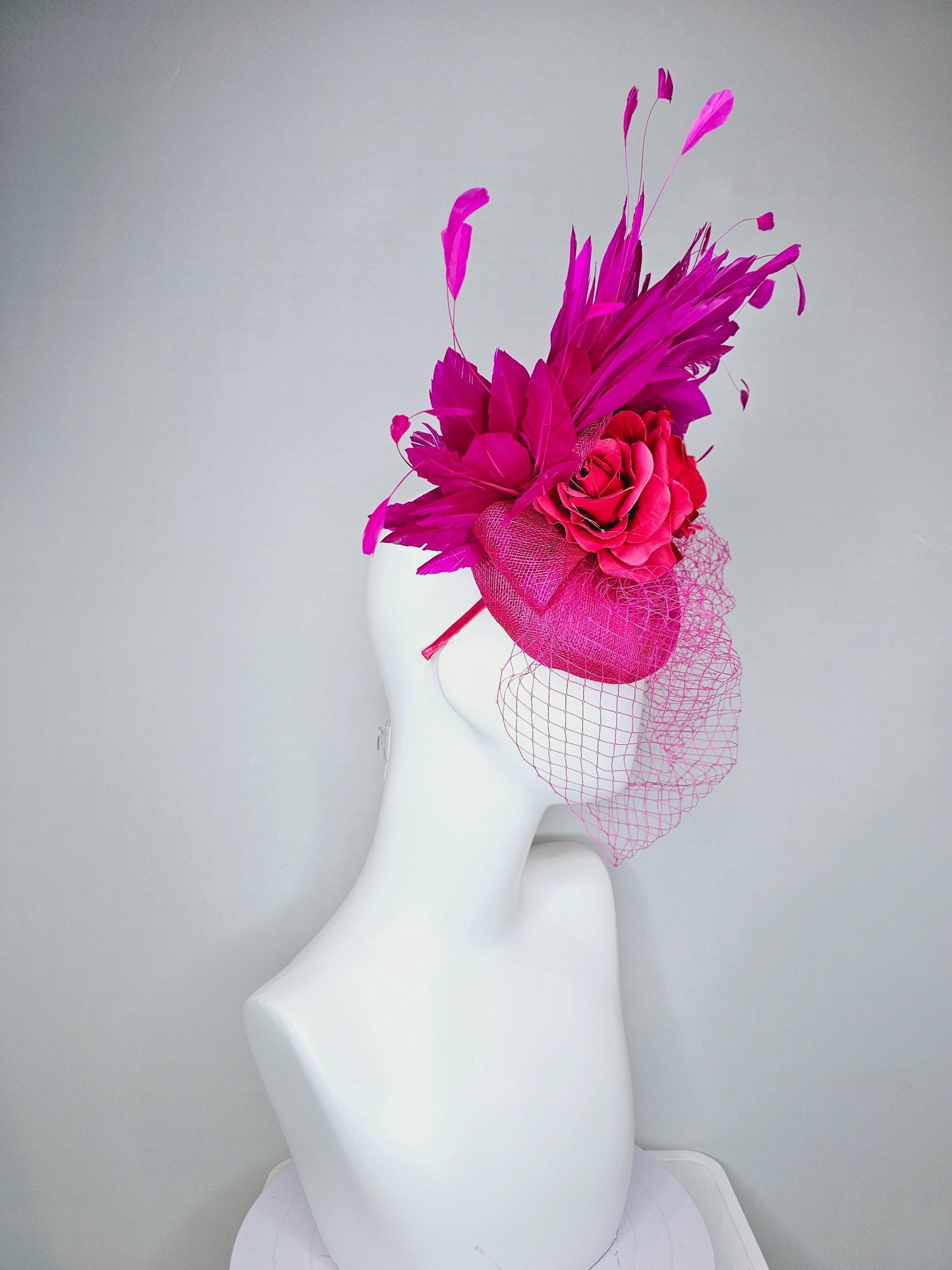 kentucky derby hat fascinator bright pink sinamay with sinamay bow and raspberry pink satin roses fuchsia pink feathers and pink mesh veil