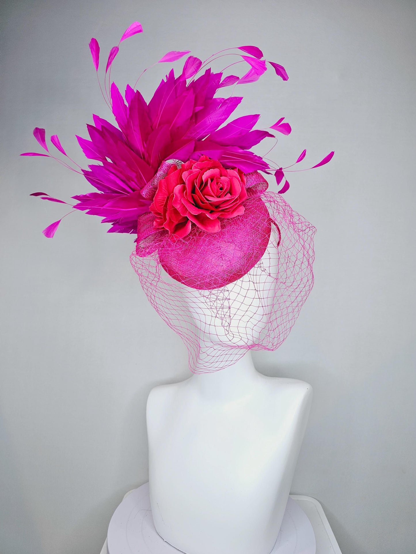 kentucky derby hat fascinator bright pink sinamay with sinamay bow and raspberry pink satin roses fuchsia pink feathers and pink mesh veil