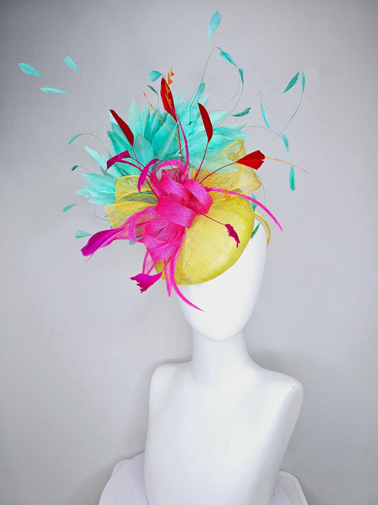 kentucky derby hat fascinator yellow sinamay with yellow and pink sinamay bow pink and red feathers and aqua mint green branching feathers