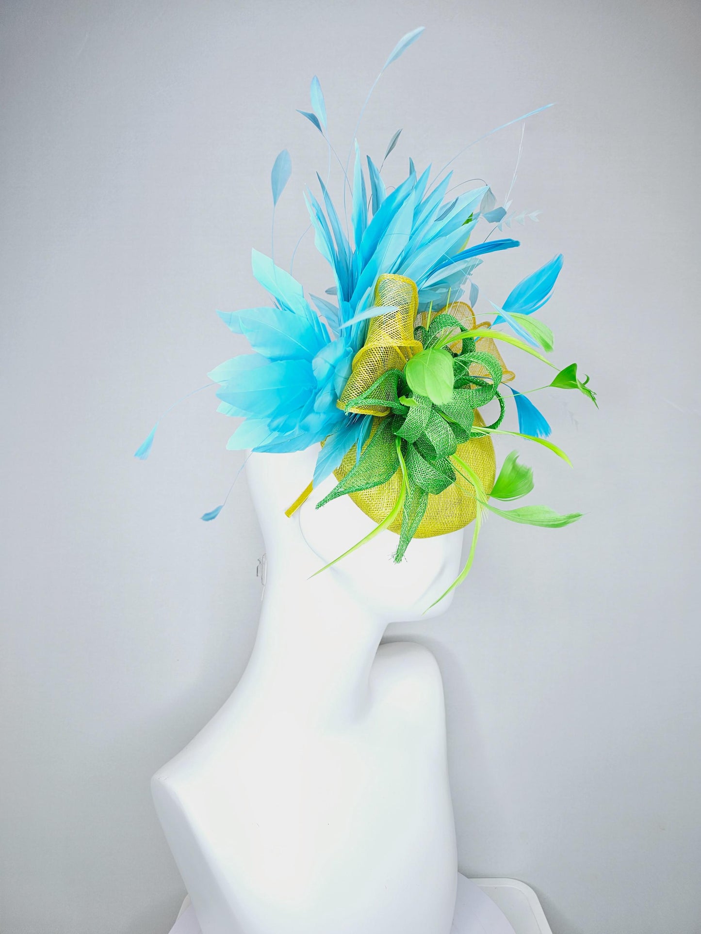 kentucky derby hat fascinator yellow sinamay with yellow and lime green sinamay bow white cut feathers and sky blue branching feathers