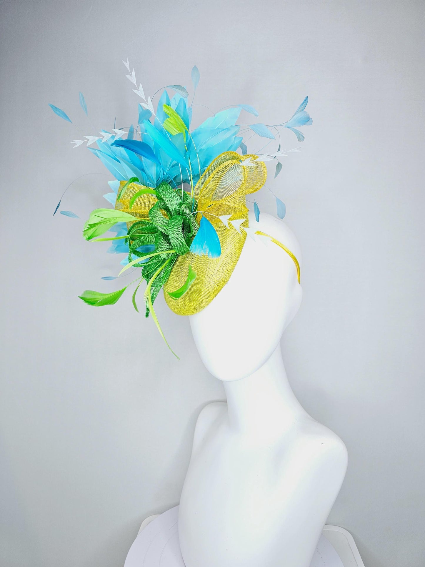 kentucky derby hat fascinator yellow sinamay with yellow and lime green sinamay bow white cut feathers and sky blue branching feathers