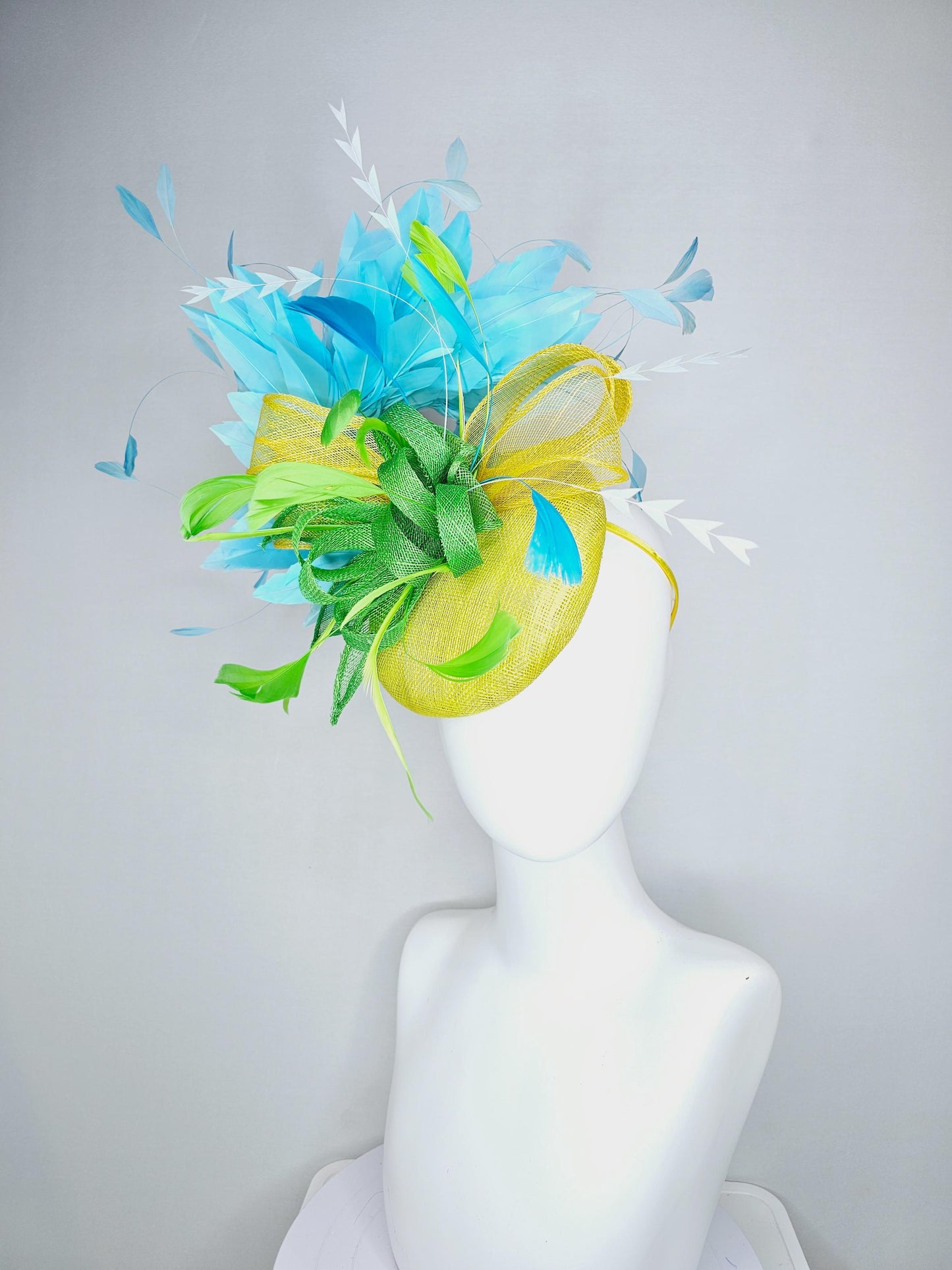 kentucky derby hat fascinator yellow sinamay with yellow and lime green sinamay bow white cut feathers and sky blue branching feathers