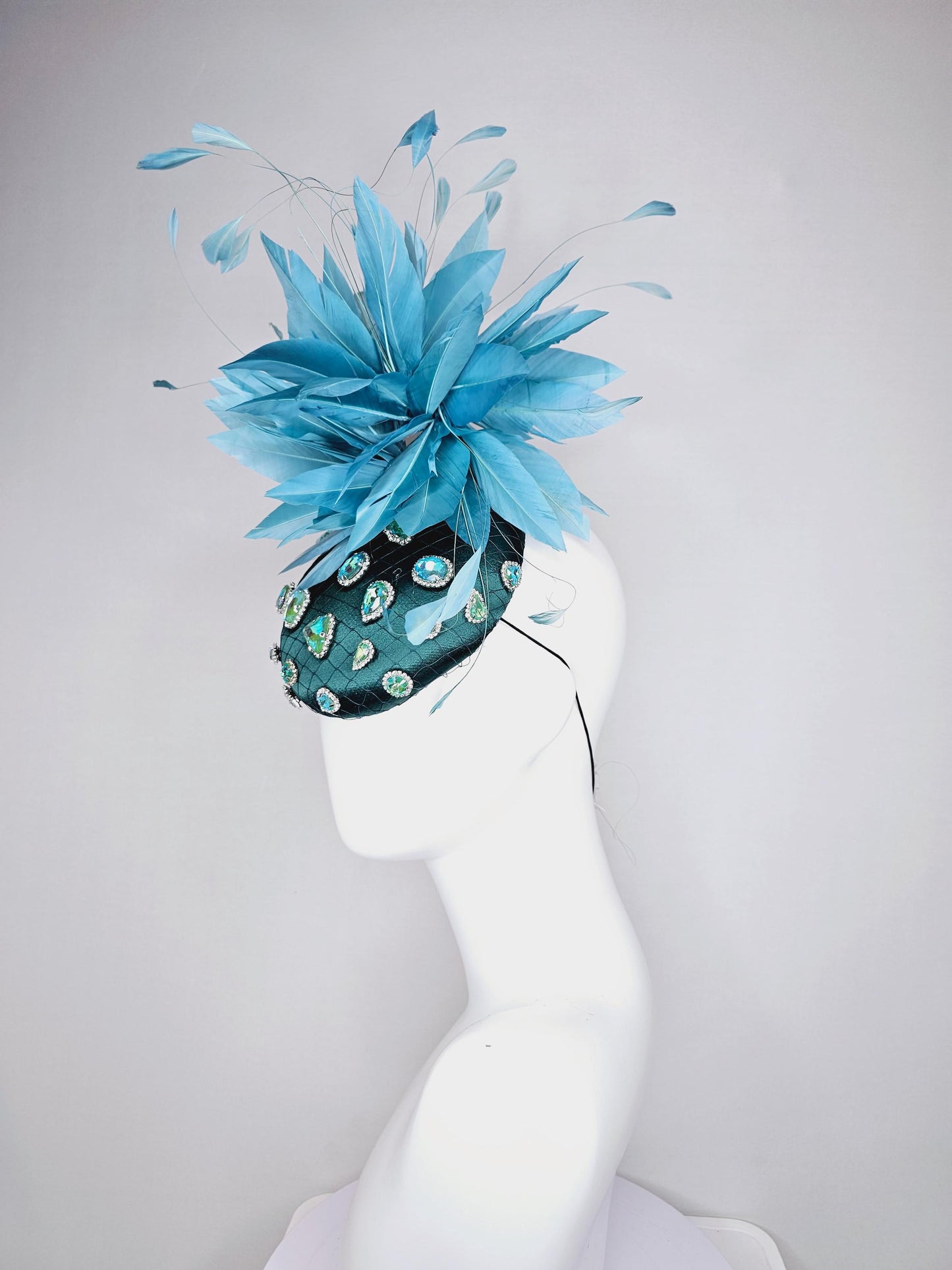 kentucky derby hat fascinator dark green satin with netting and green iridescent crystal rhinestone beaded fluffy peacock teal blue feathers
