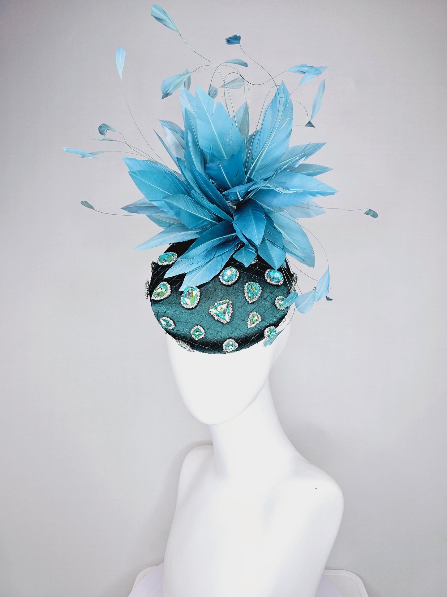 kentucky derby hat fascinator dark green satin with netting and green iridescent crystal rhinestone beaded fluffy peacock teal blue feathers