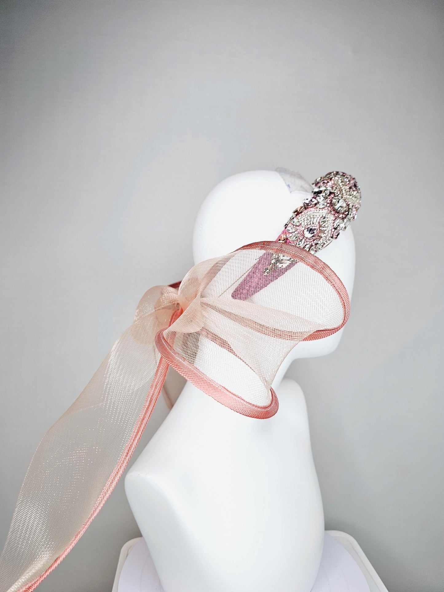 kentucky derby hat fascinator pink headband with iridescent pink tones crystal rhinestone encrusted jewels large dusty blush pink mesh bow