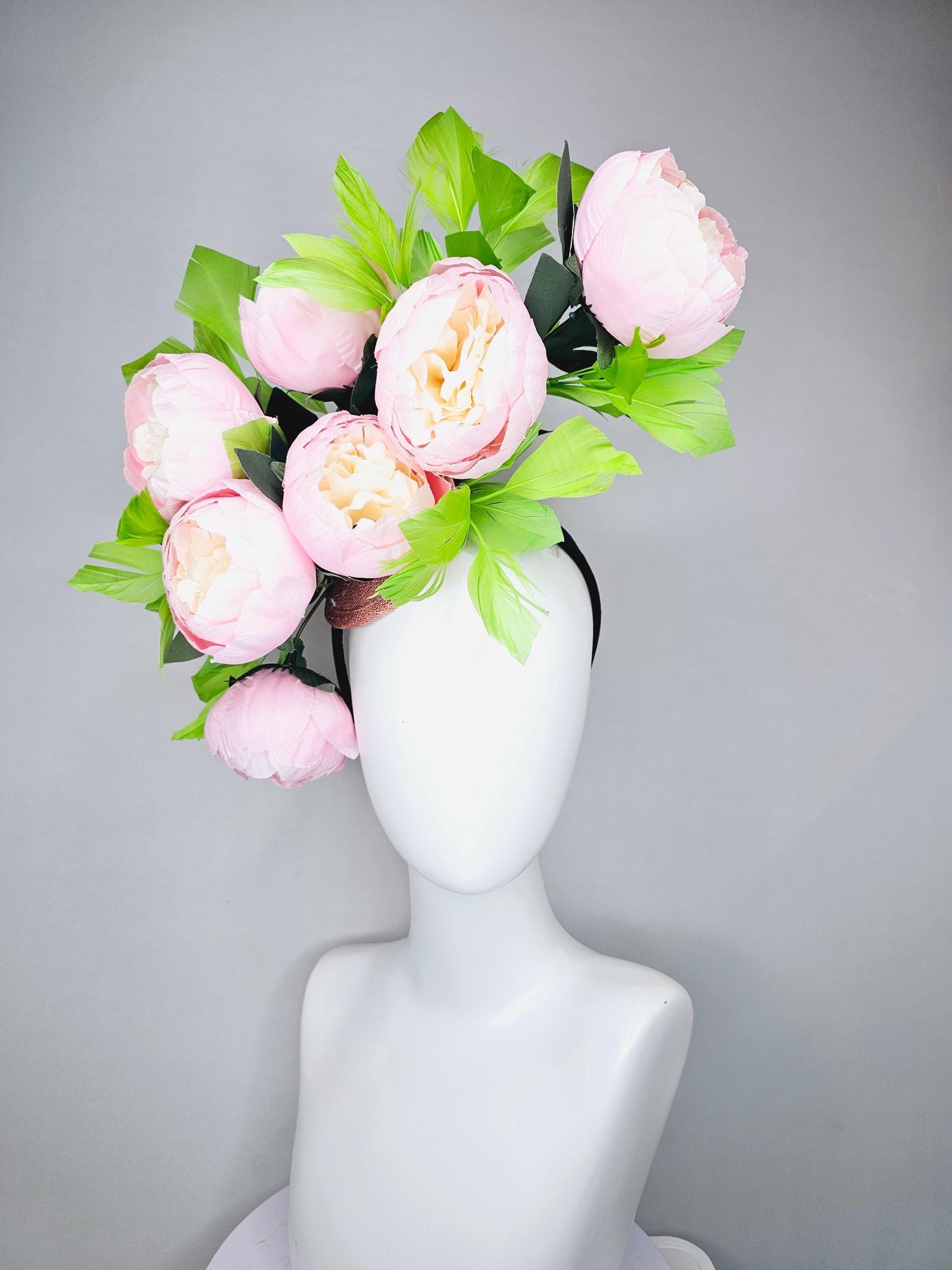 kentucky derby hat fascinator large blush pink flowers with green branching feathers large headpiece