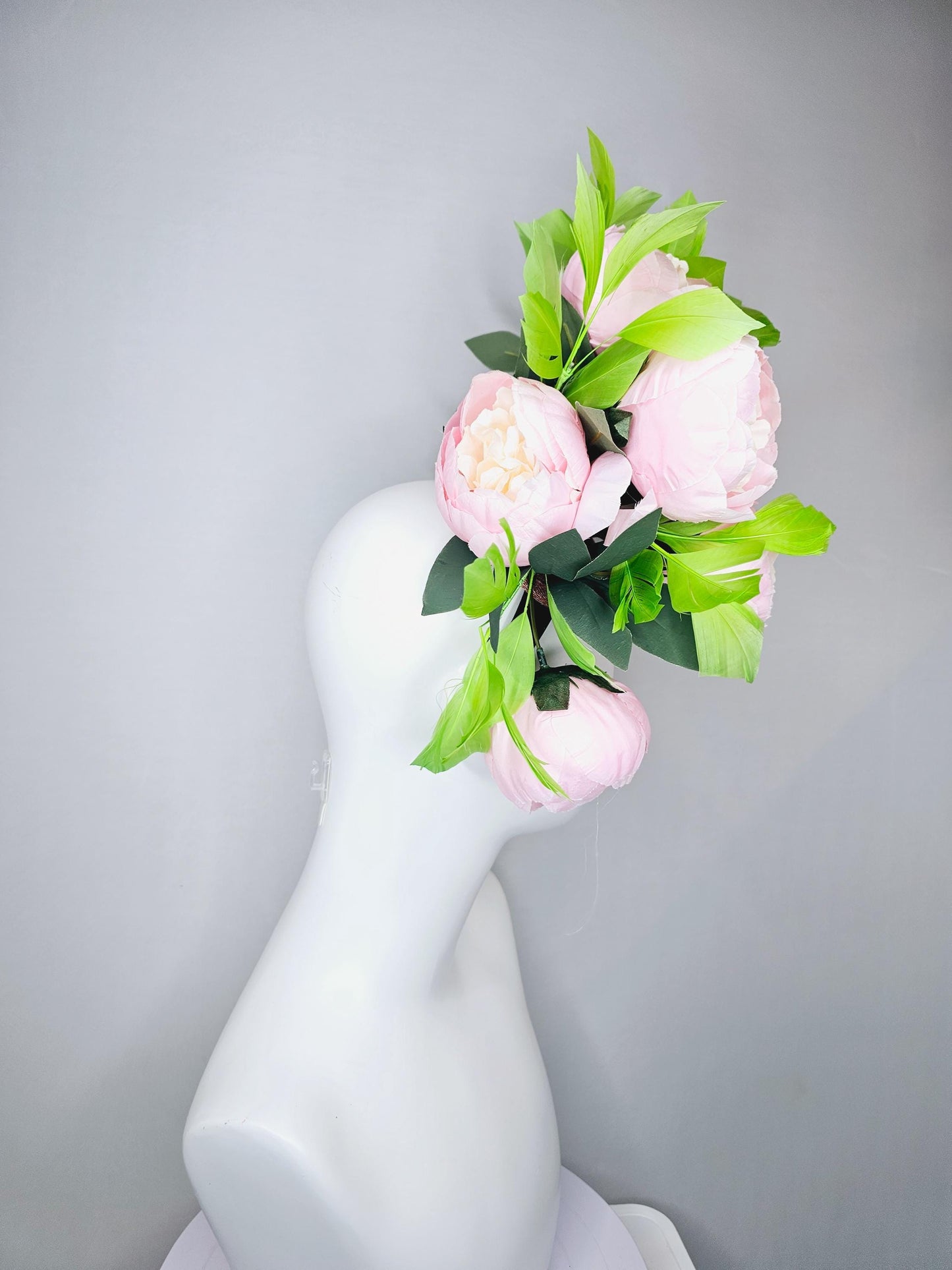 kentucky derby hat fascinator large blush pink flowers with green branching feathers large headpiece