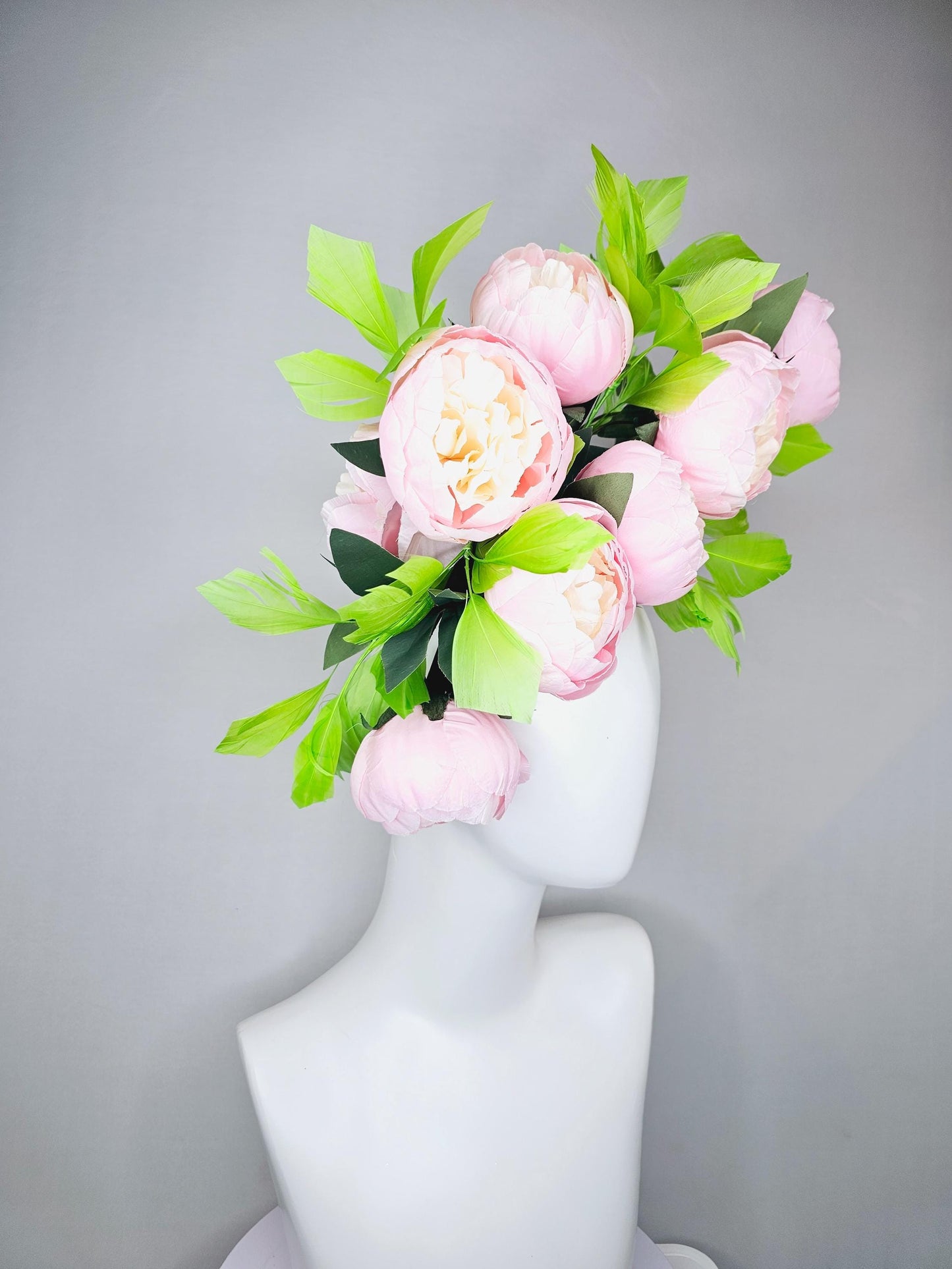 kentucky derby hat fascinator large blush pink flowers with green branching feathers large headpiece