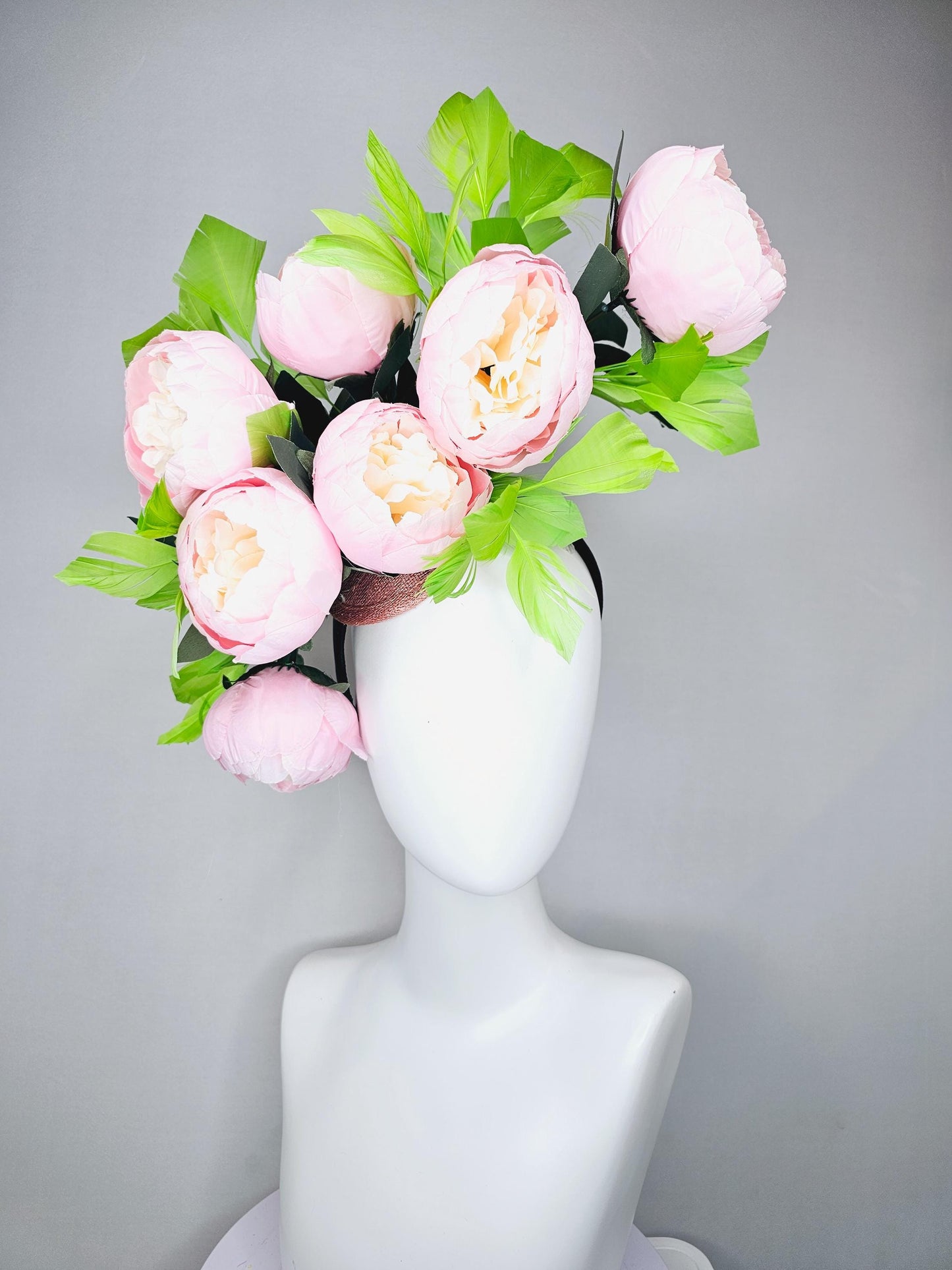 kentucky derby hat fascinator large blush pink flowers with green branching feathers large headpiece