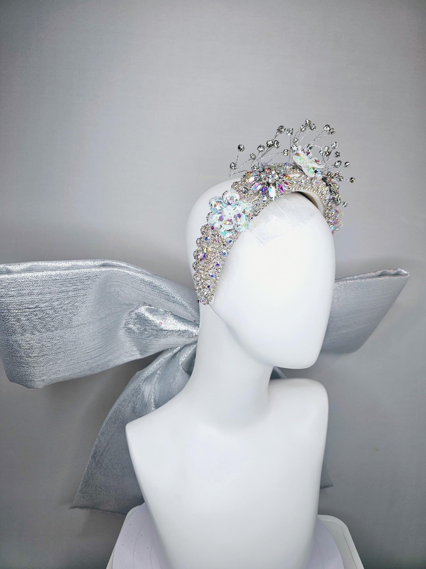 kentucky derby hat large thick crystal rhinestone tiara encrusted headband with huge silver padded ribbon bow decor along back with crystals