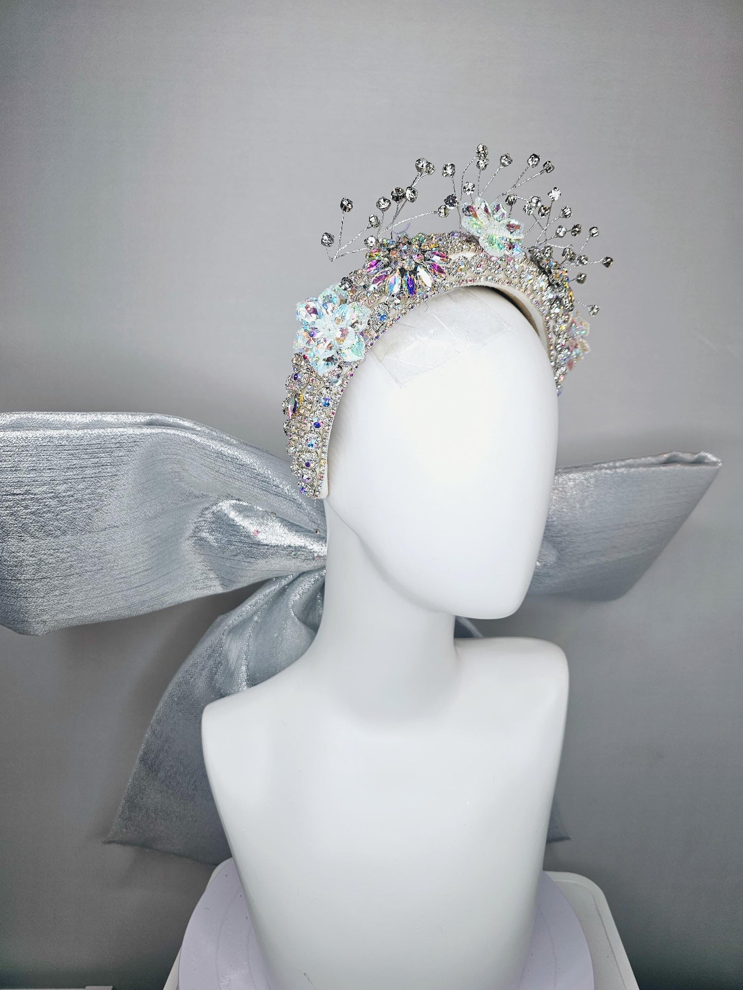 kentucky derby hat large thick crystal rhinestone tiara encrusted headband with huge silver padded ribbon bow decor along back with crystals
