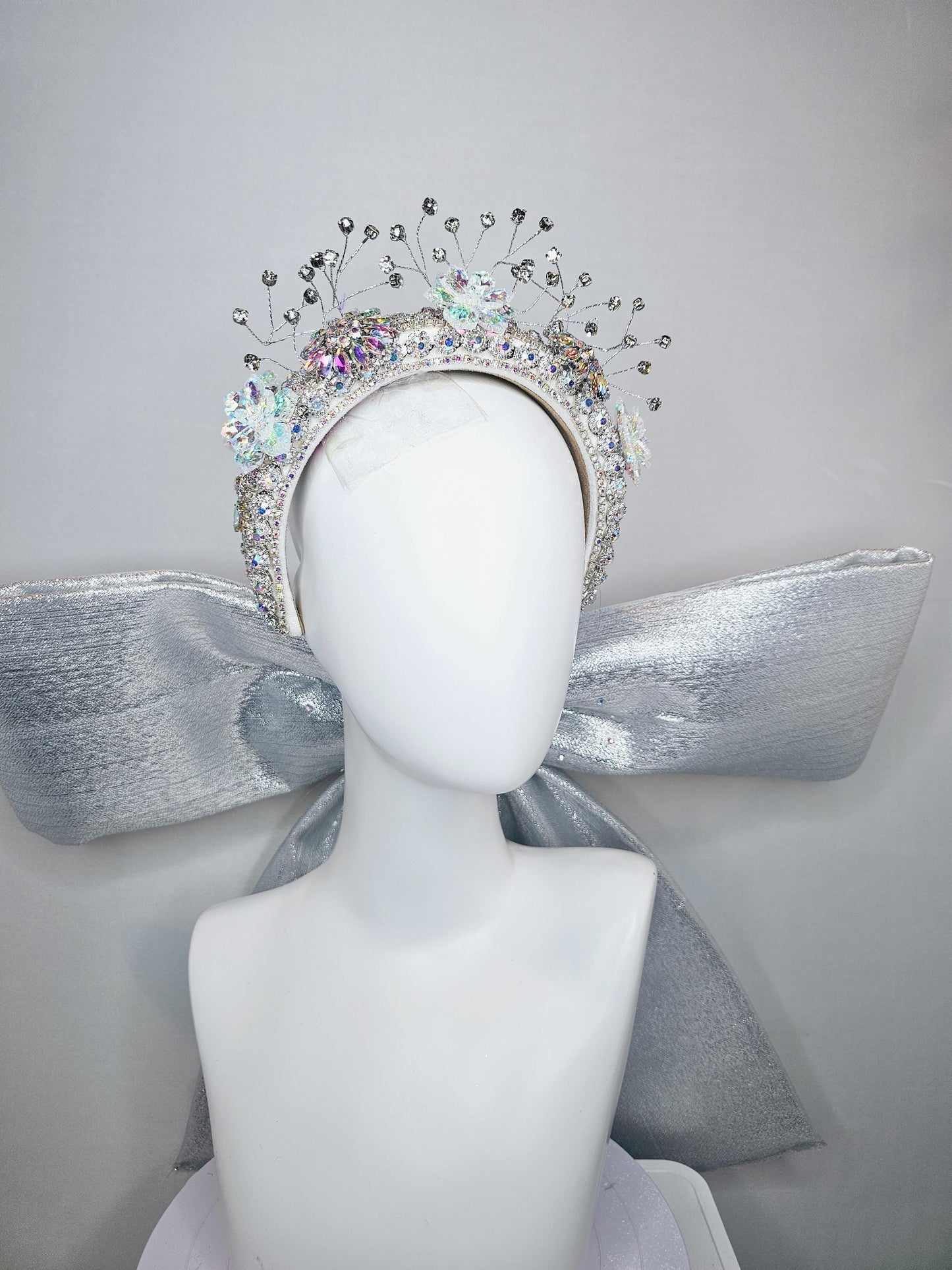 kentucky derby hat large thick crystal rhinestone tiara encrusted headband with huge silver padded ribbon bow decor along back with crystals